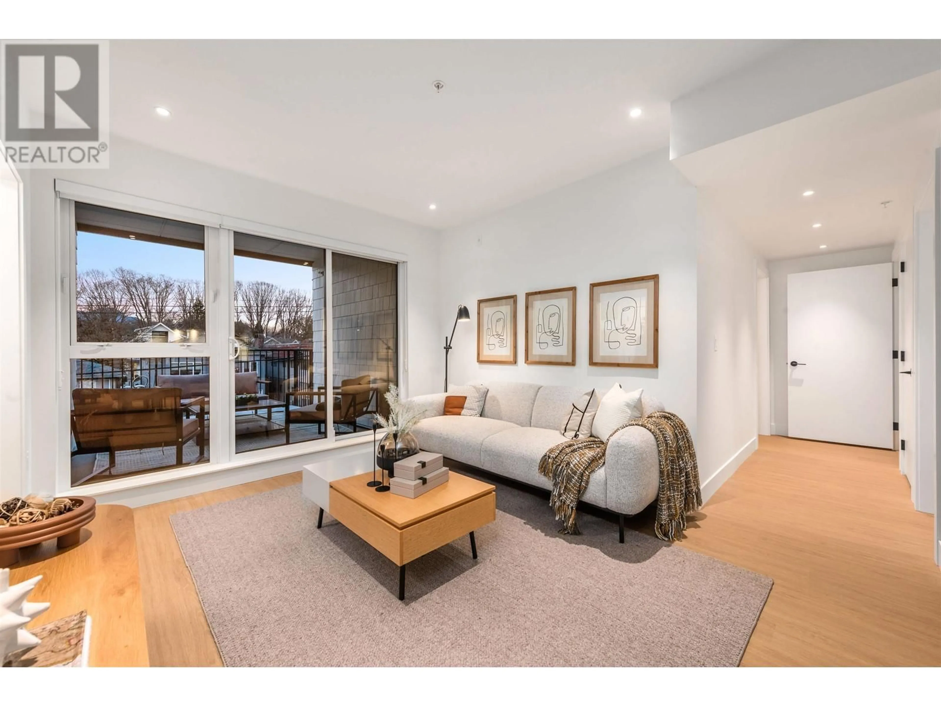 Living room with furniture, wood/laminate floor for 602 - 2235 BROADWAY, Vancouver British Columbia V5N0J5