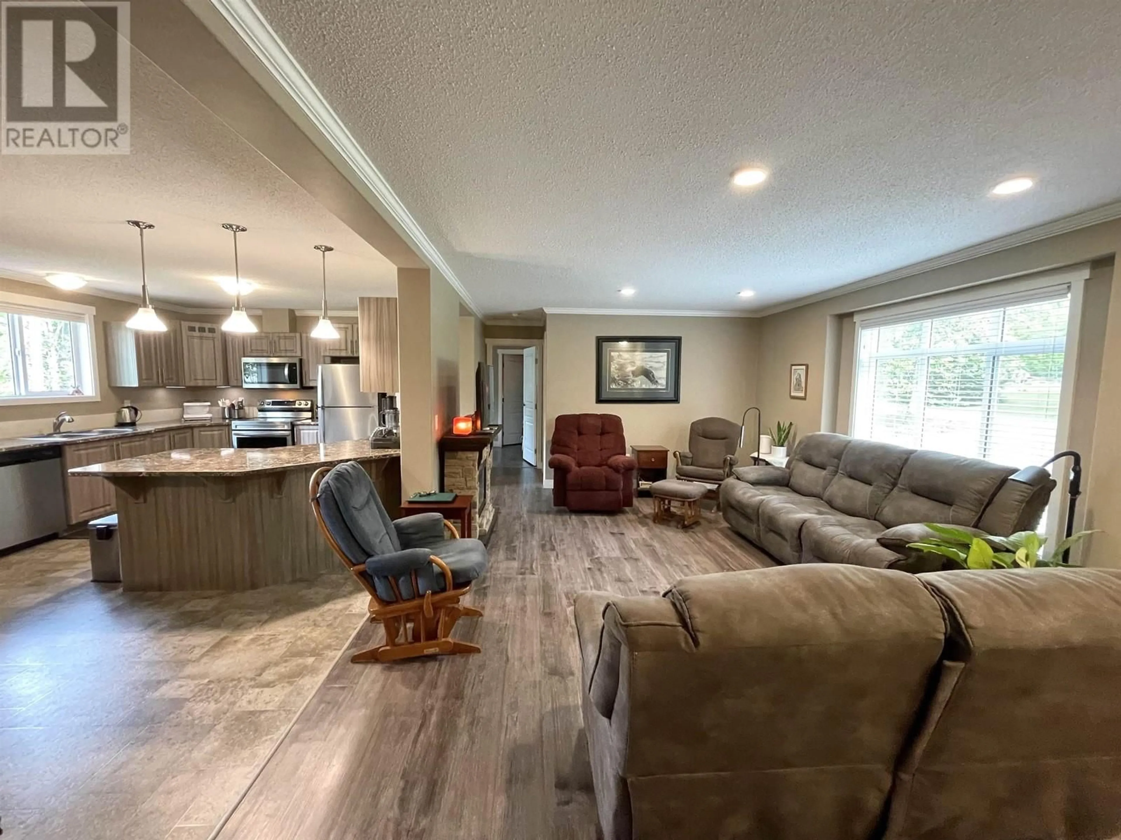 Living room with furniture, wood/laminate floor for 5243 4TH AVENUE, Hazelton British Columbia V0J1Y1