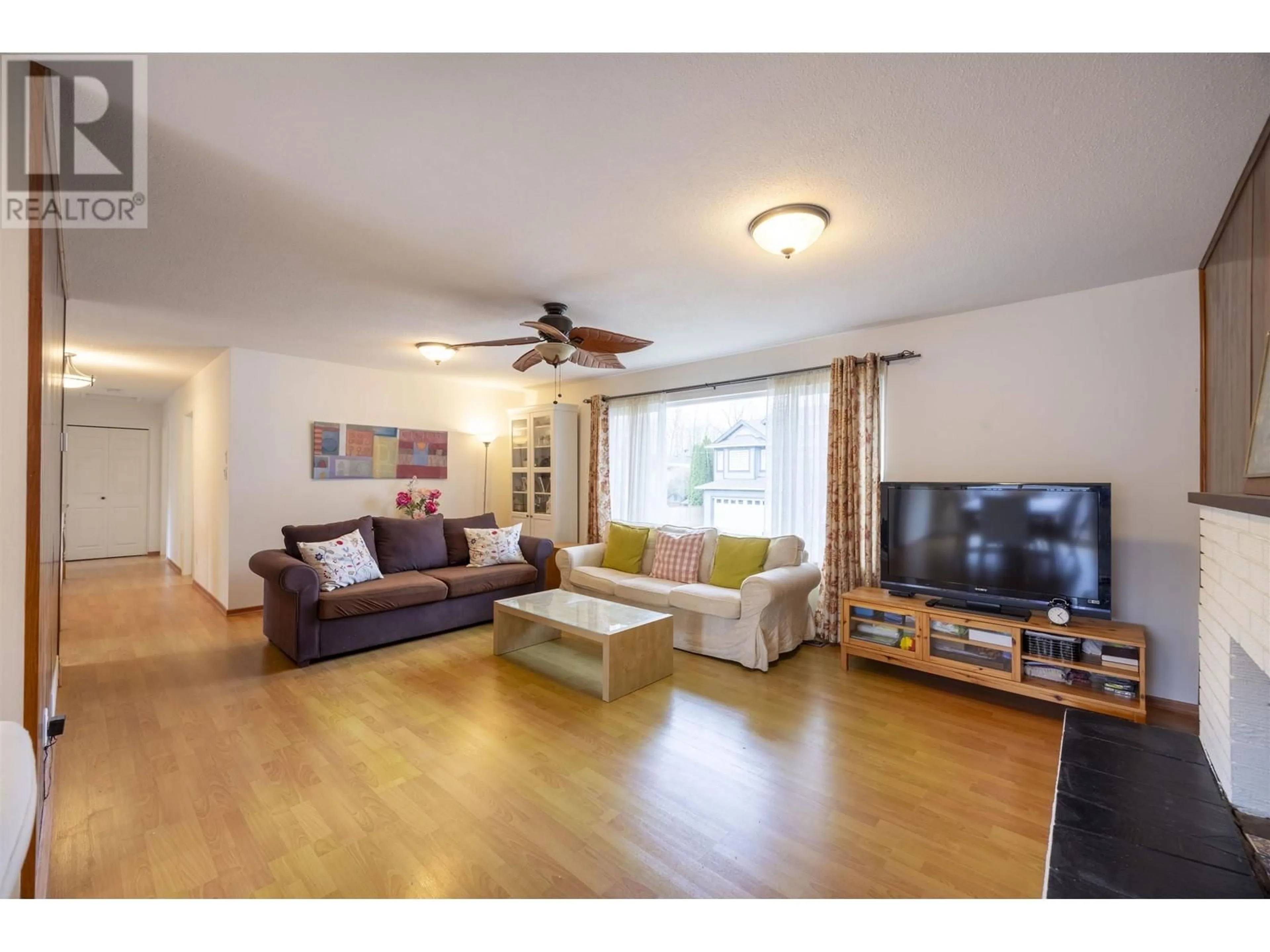 Living room with furniture, wood/laminate floor for 2429 CHILCOTT AVENUE, Port Coquitlam British Columbia V3B1Y4