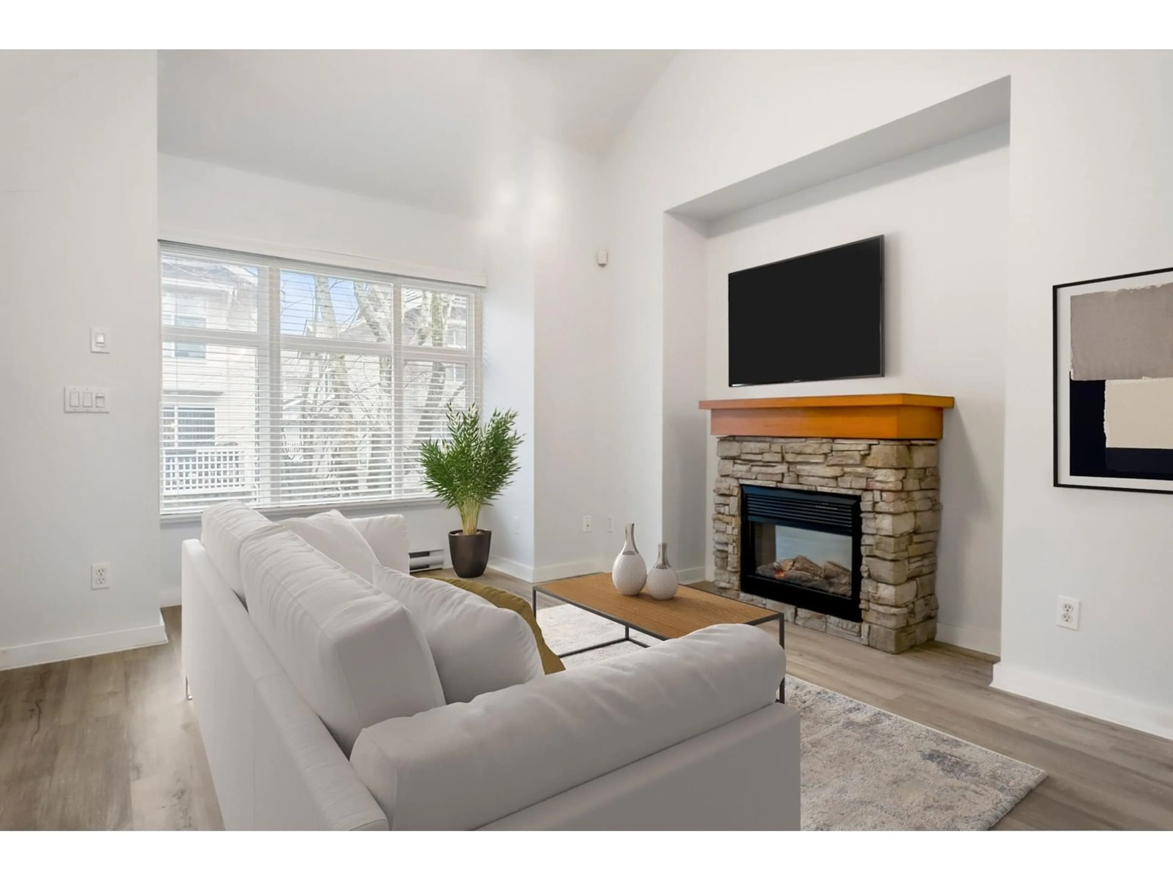Living room with furniture, wood/laminate floor for 4 - 7179 201, Langley British Columbia V2Y2Y9