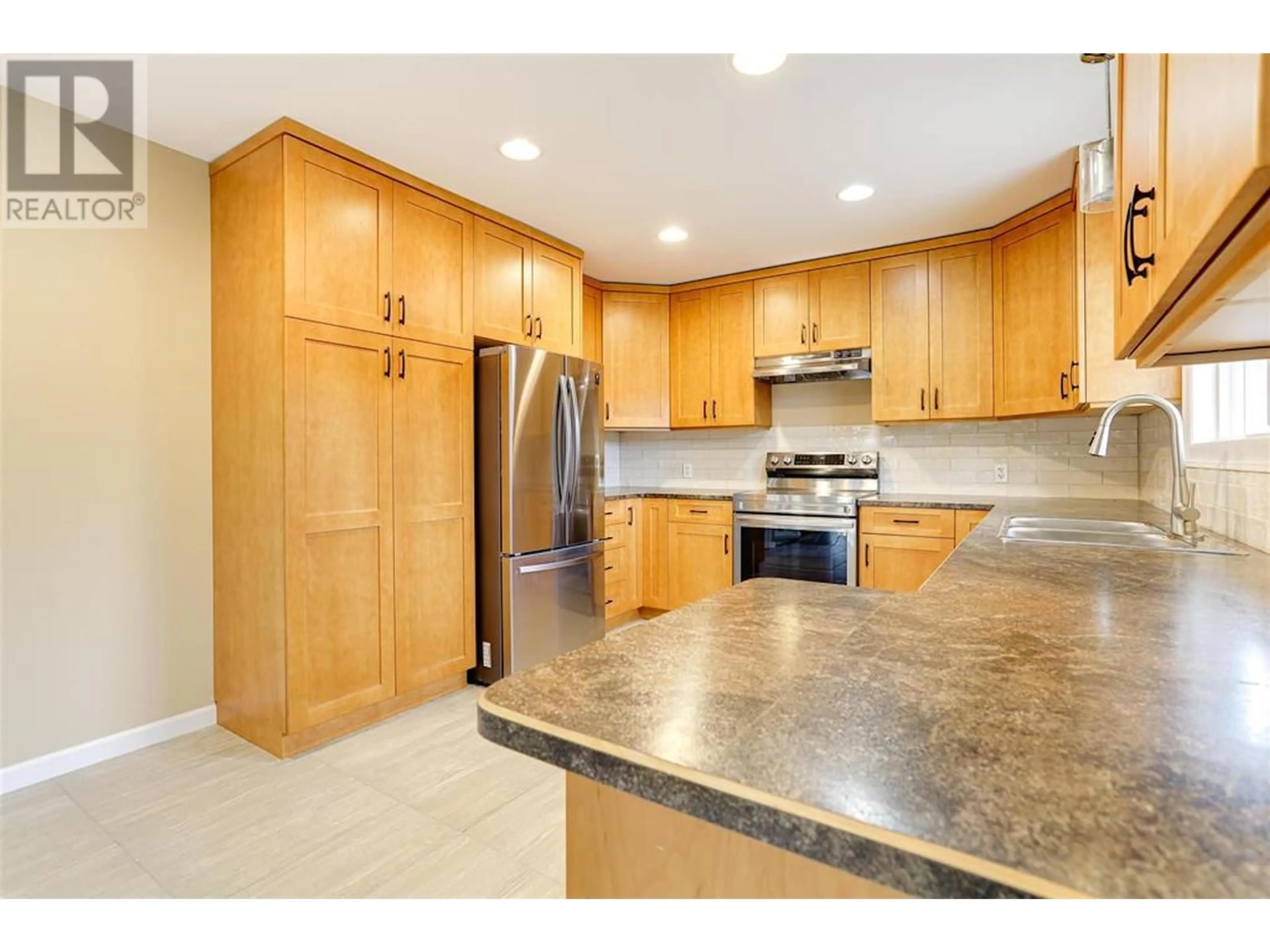 Open concept kitchen, ceramic/tile floor for 1461 CORMORANT AVENUE, Kitimat British Columbia V8C1R9
