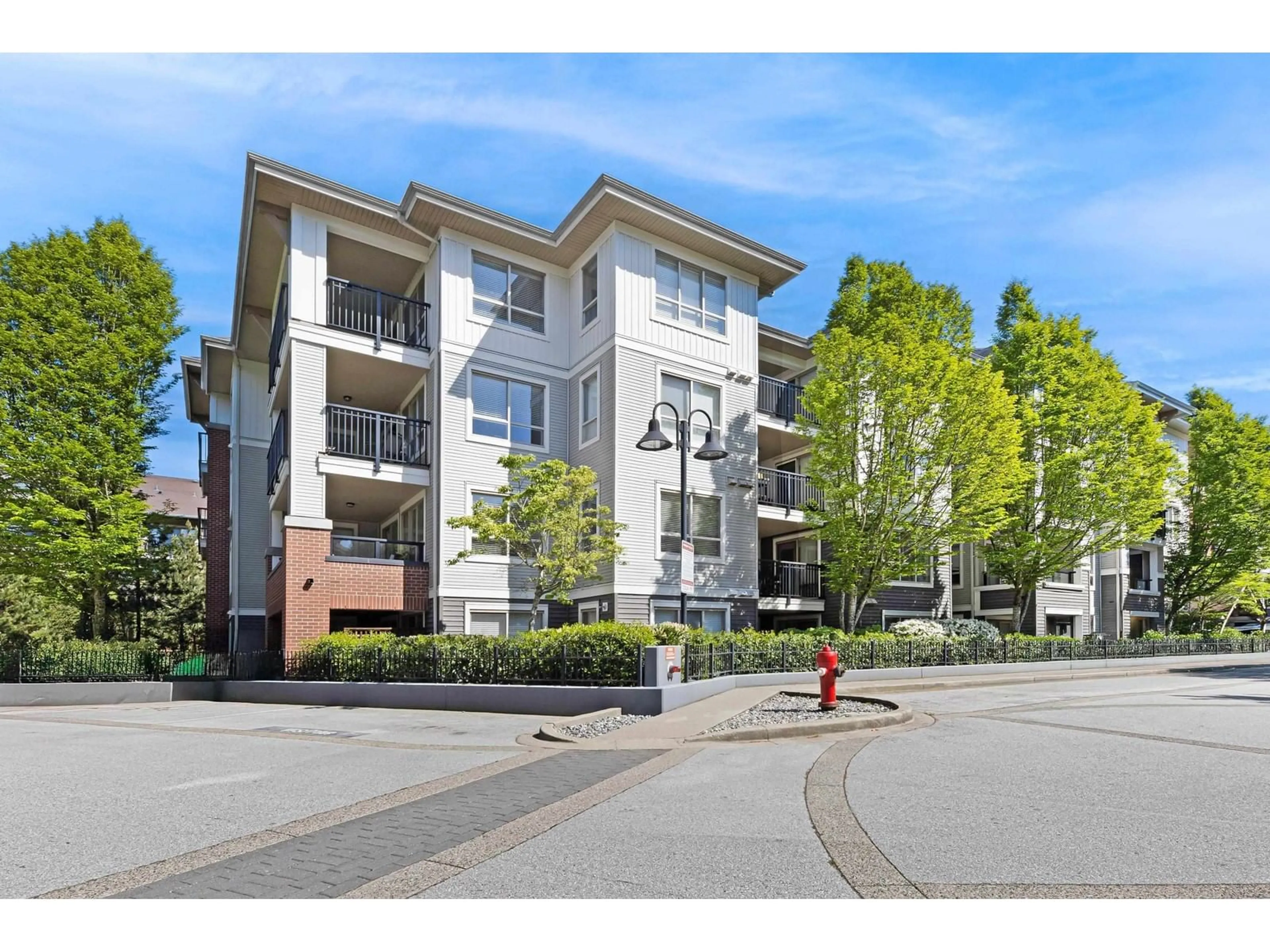 A pic from outside/outdoor area/front of a property/back of a property/a pic from drone, street for A205 - 8929 202, Langley British Columbia V1M0B4