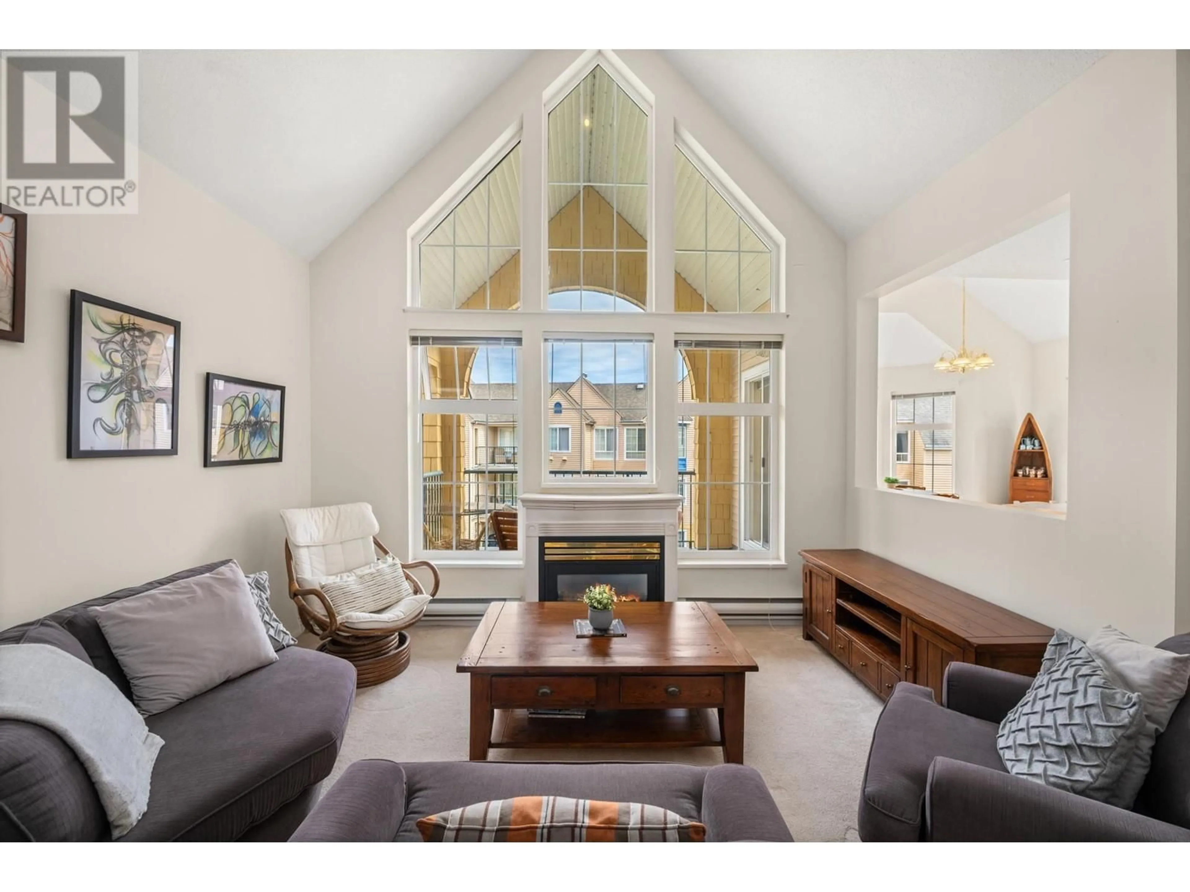 Living room with furniture, wood/laminate floor for 301 - 5555 13A AVENUE, Tsawwassen British Columbia V4M2E7