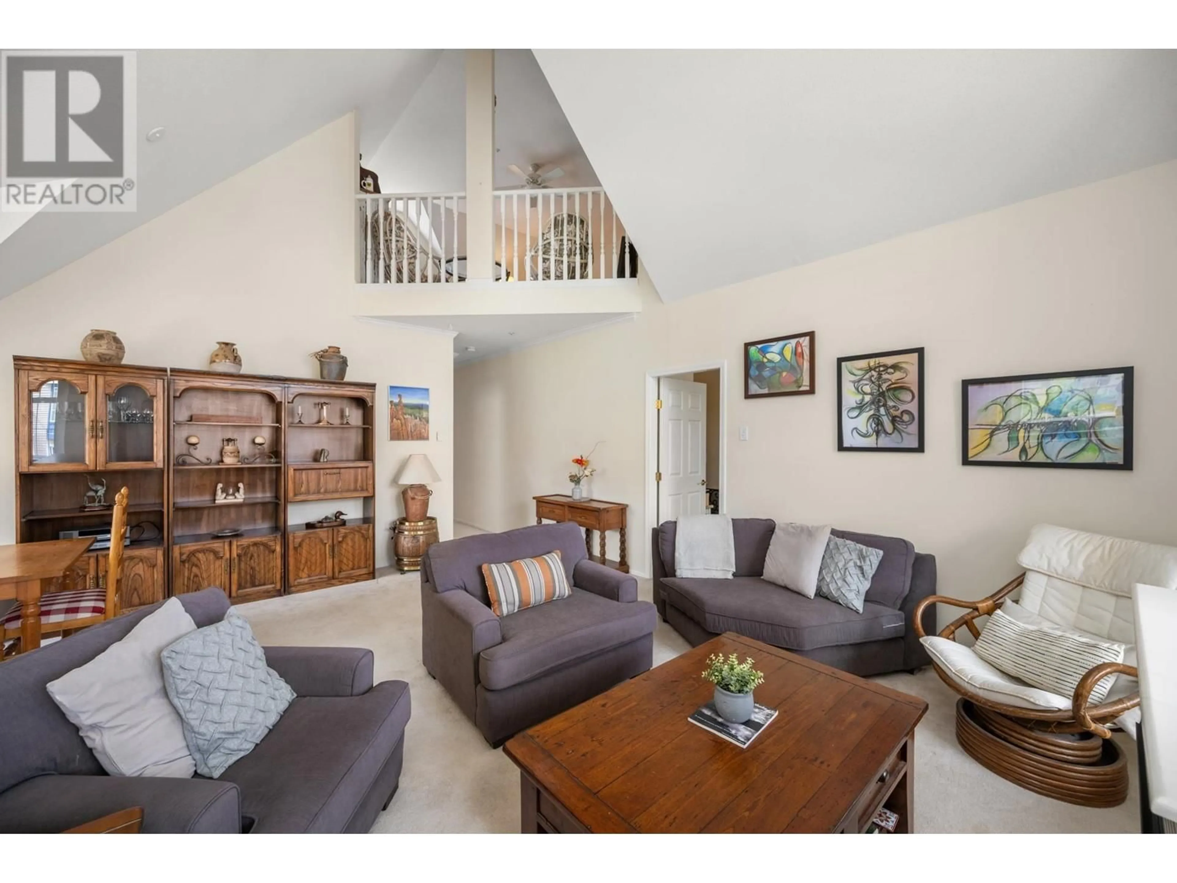 Living room with furniture, wood/laminate floor for 301 - 5555 13A AVENUE, Tsawwassen British Columbia V4M2E7
