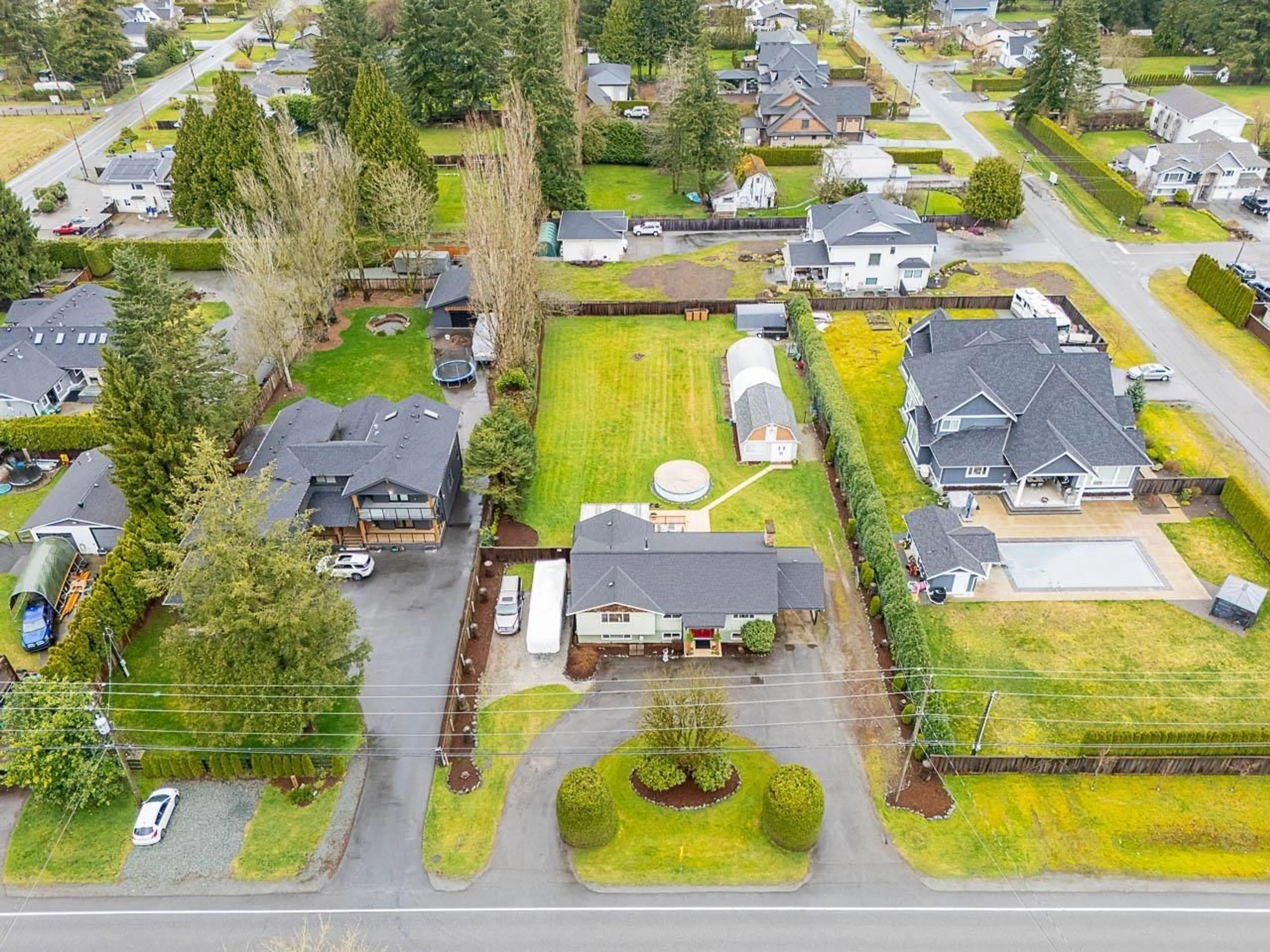 A pic from outside/outdoor area/front of a property/back of a property/a pic from drone, street for 24457 56, Langley British Columbia V2Z1B8