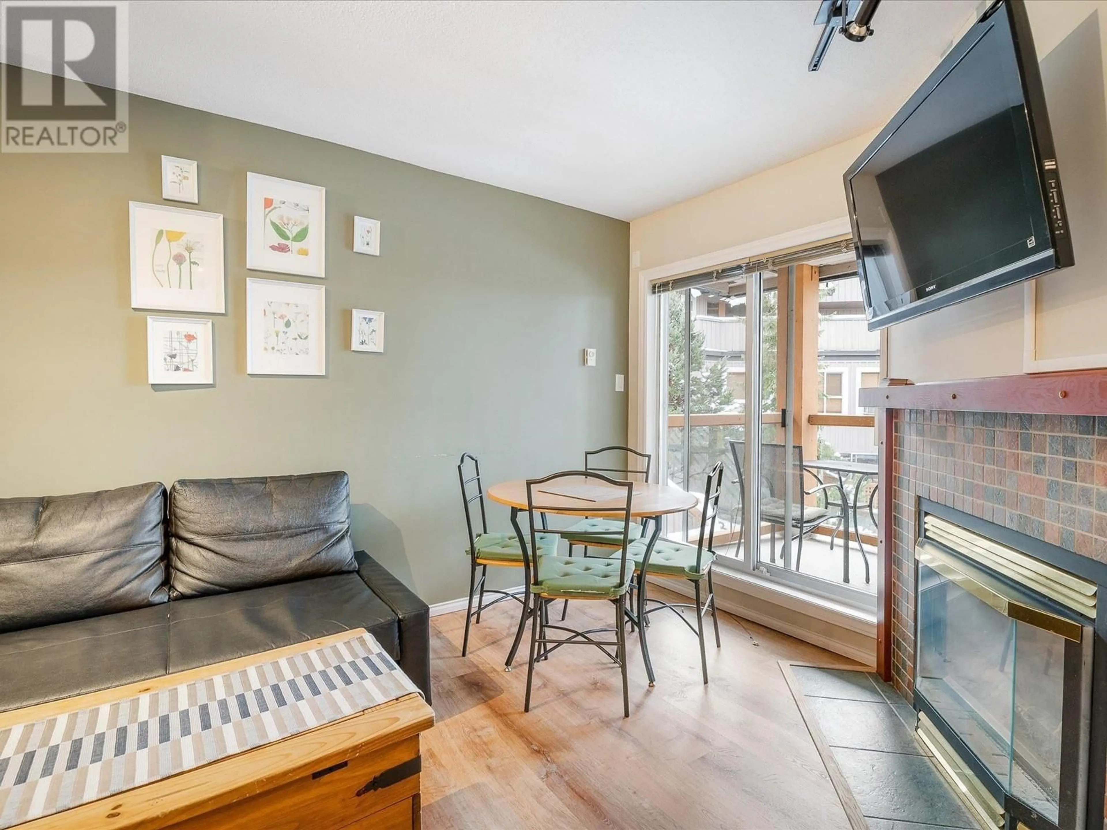 Living room with furniture, wood/laminate floor for 102 - 4388 NORTHLANDS BOULEVARD, Whistler British Columbia V0N1B4
