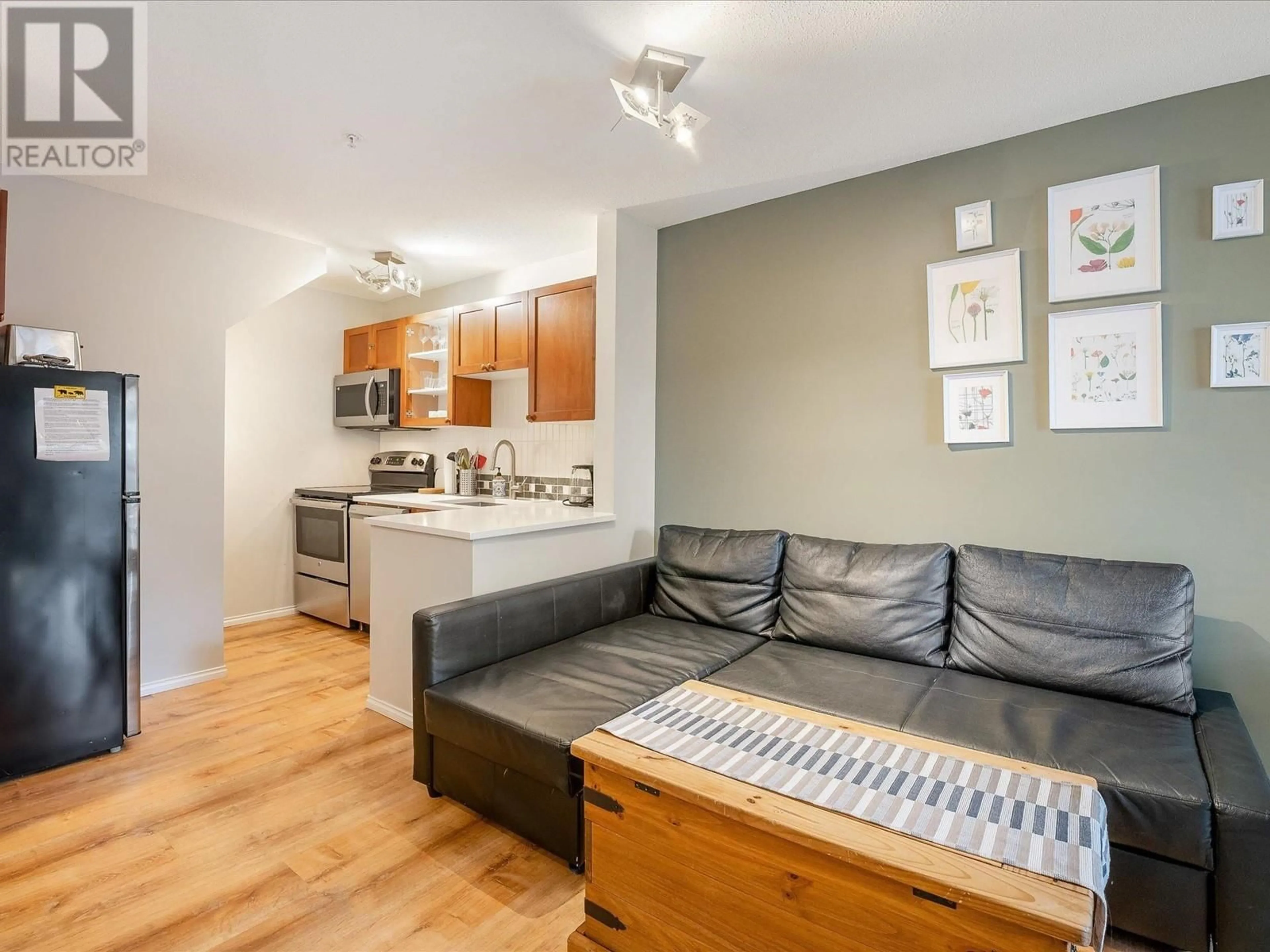 Living room with furniture, wood/laminate floor for 102 - 4388 NORTHLANDS BOULEVARD, Whistler British Columbia V0N1B4