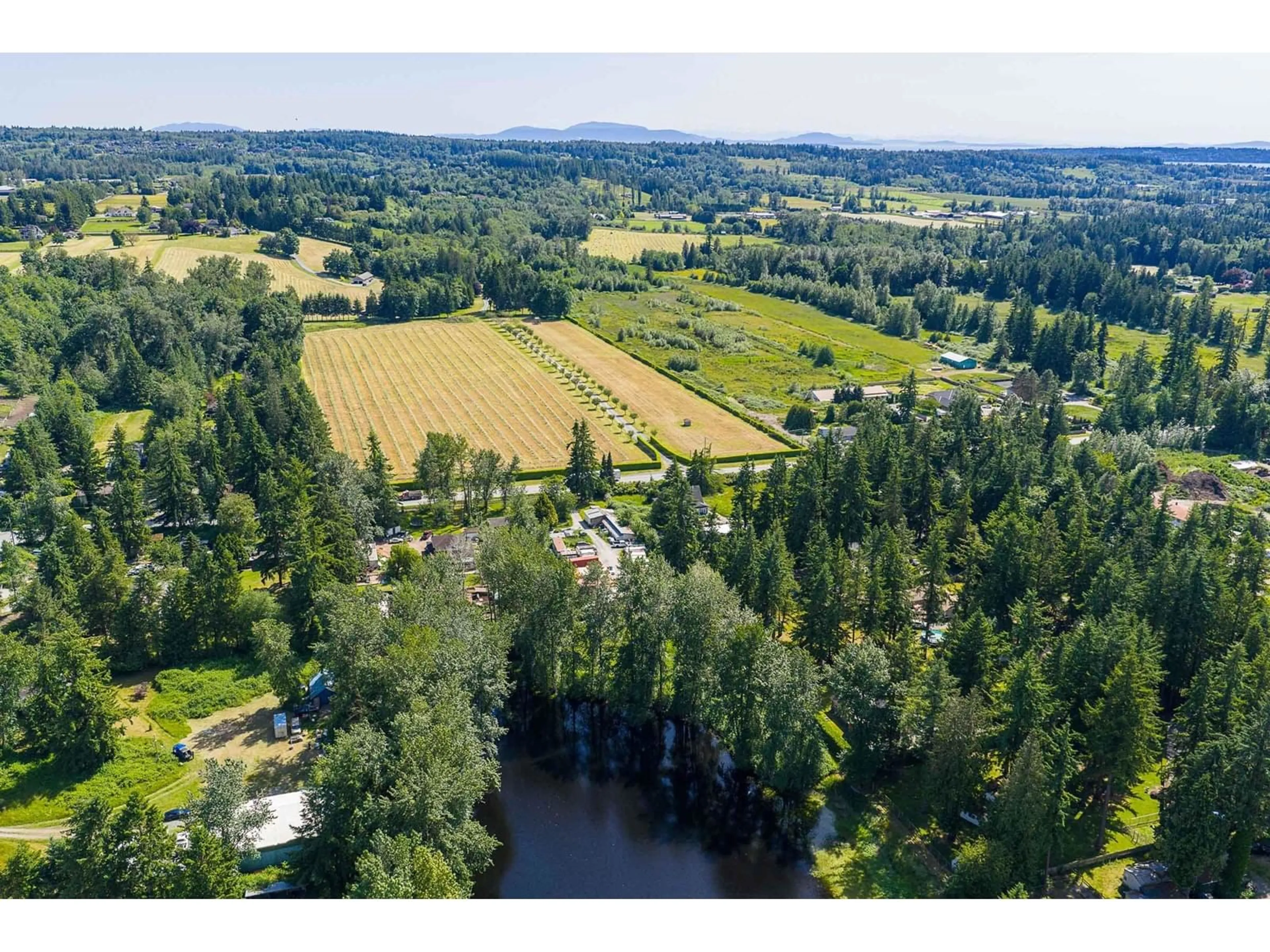 A pic from outside/outdoor area/front of a property/back of a property/a pic from drone, water/lake/river/ocean view for 19675 16, Langley British Columbia V2Z1K2