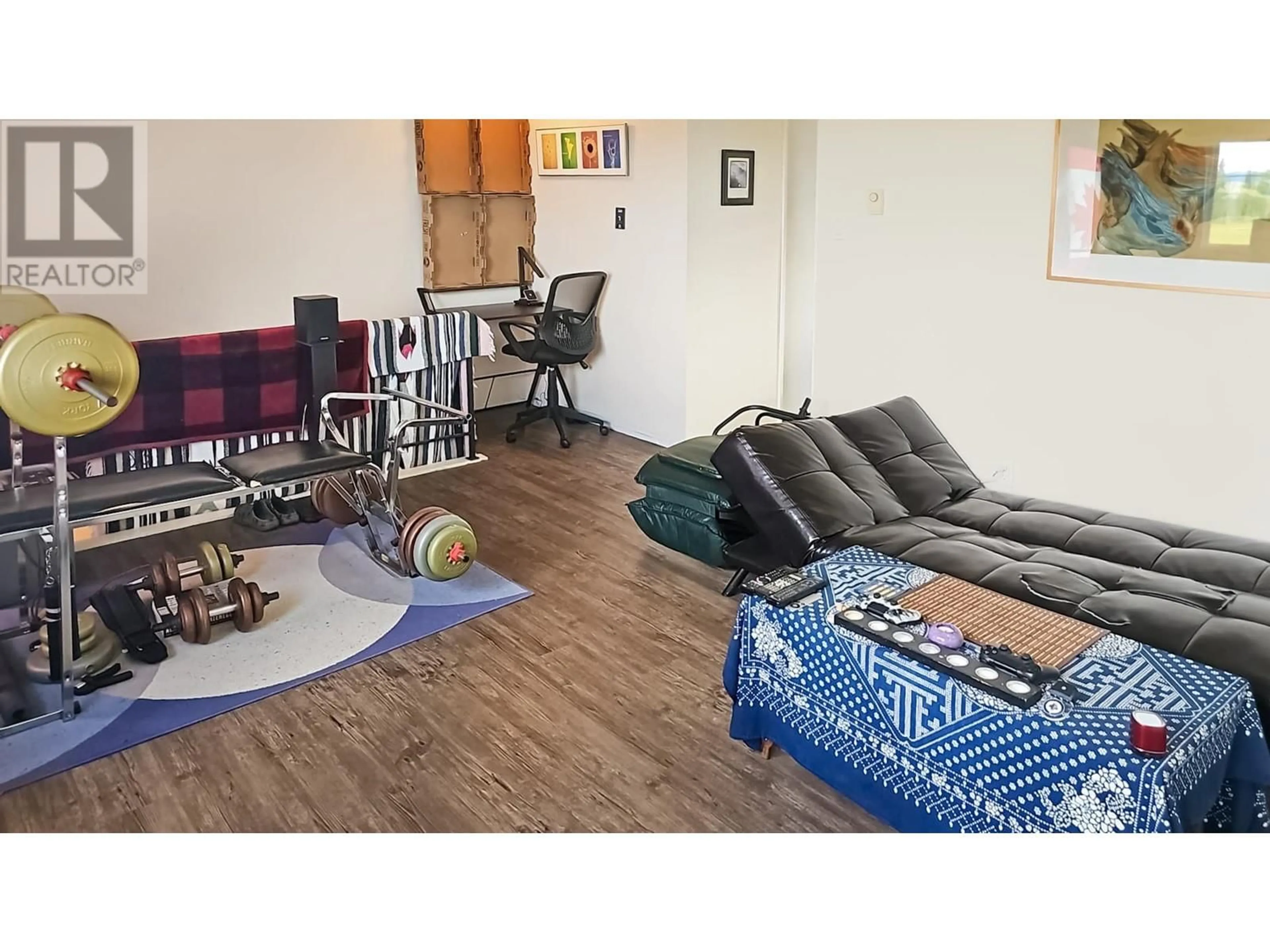 Living room with furniture, wood/laminate floor for 20 MORRISON STREET, Granisle British Columbia V1J1X4