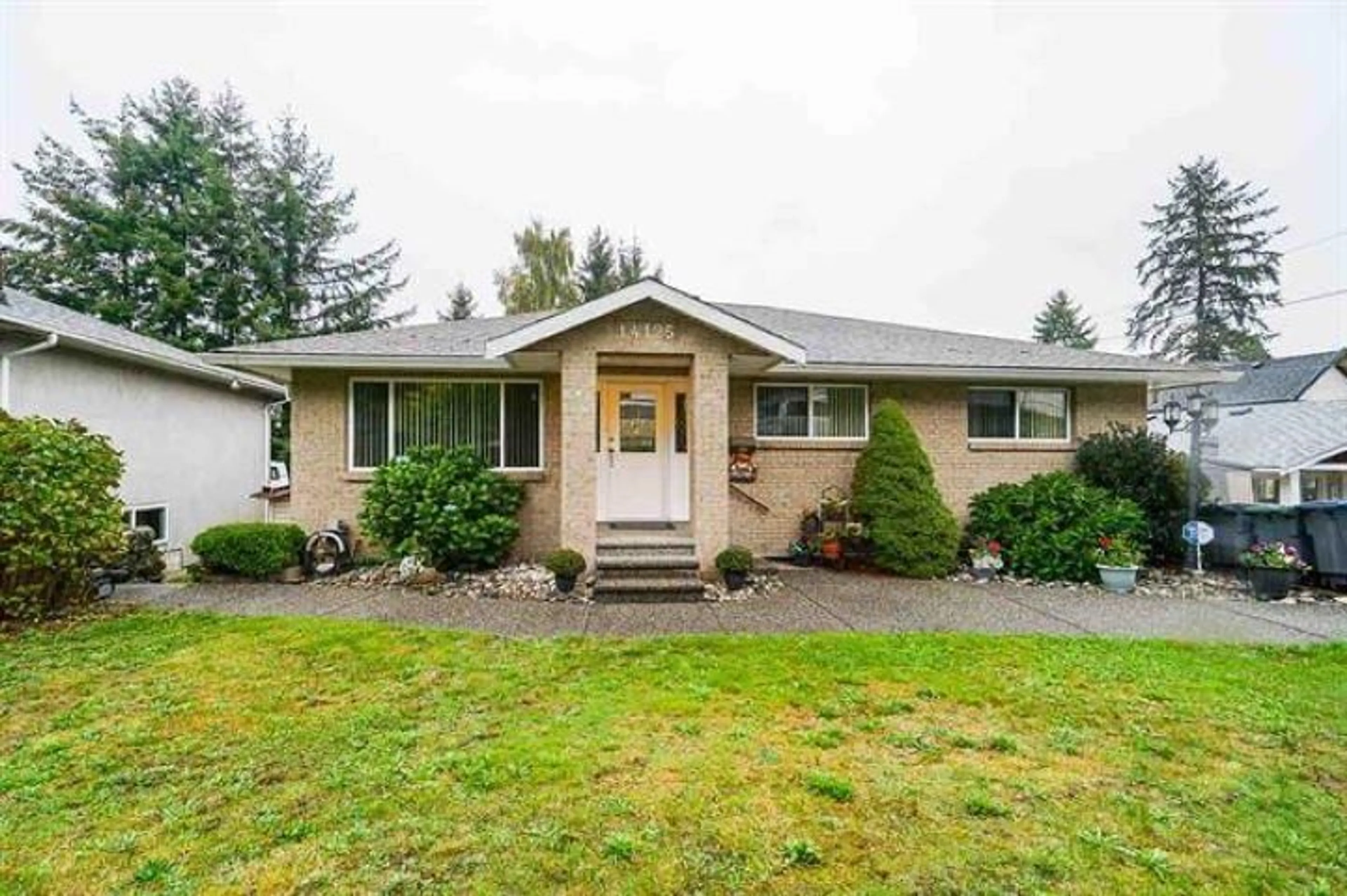 Home with vinyl exterior material, street for 14125 115, Surrey British Columbia V3R2P7