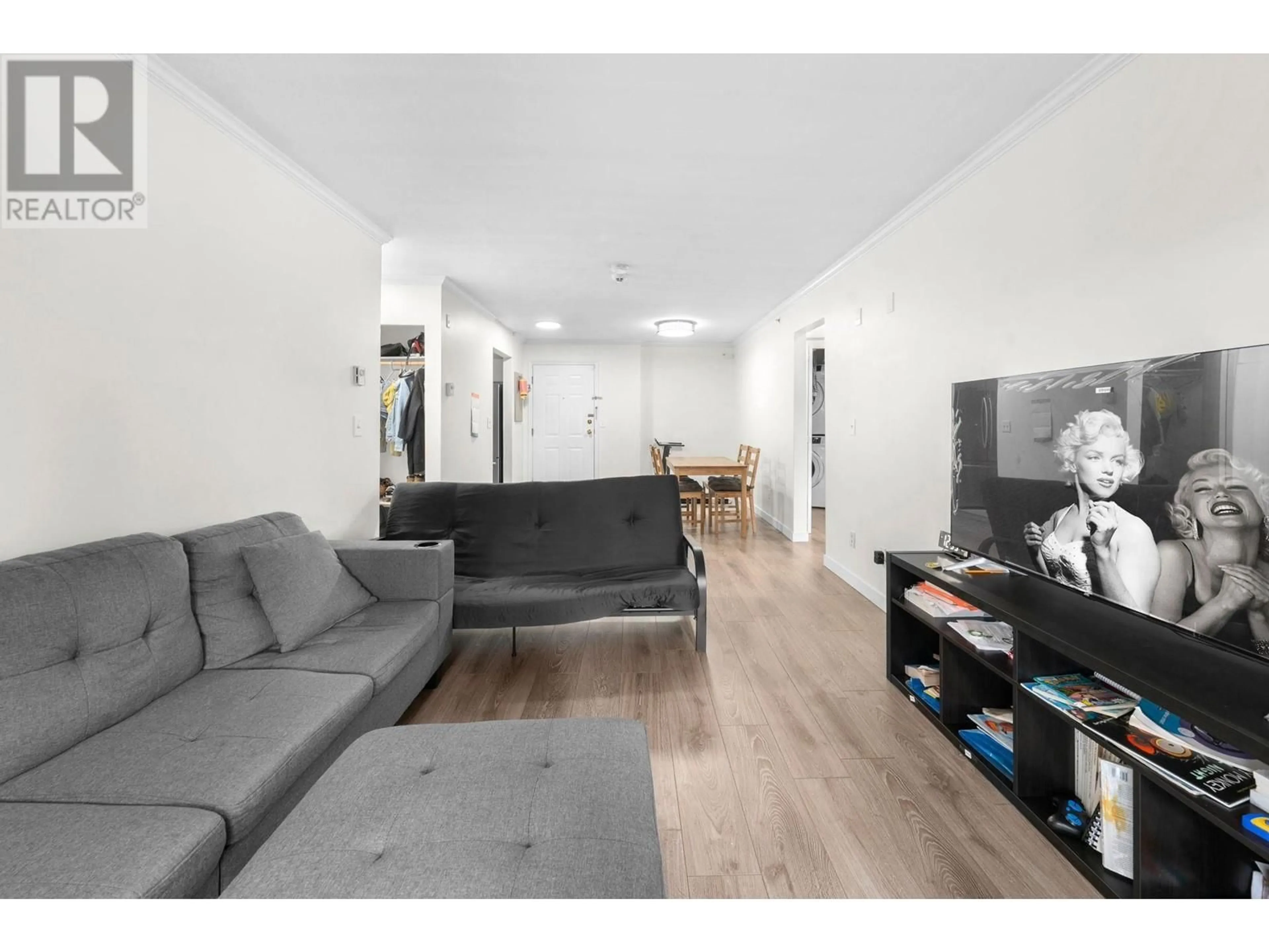 Living room with furniture, wood/laminate floor for 306 - 3624 FRASER STREET, Vancouver British Columbia V5V4C8