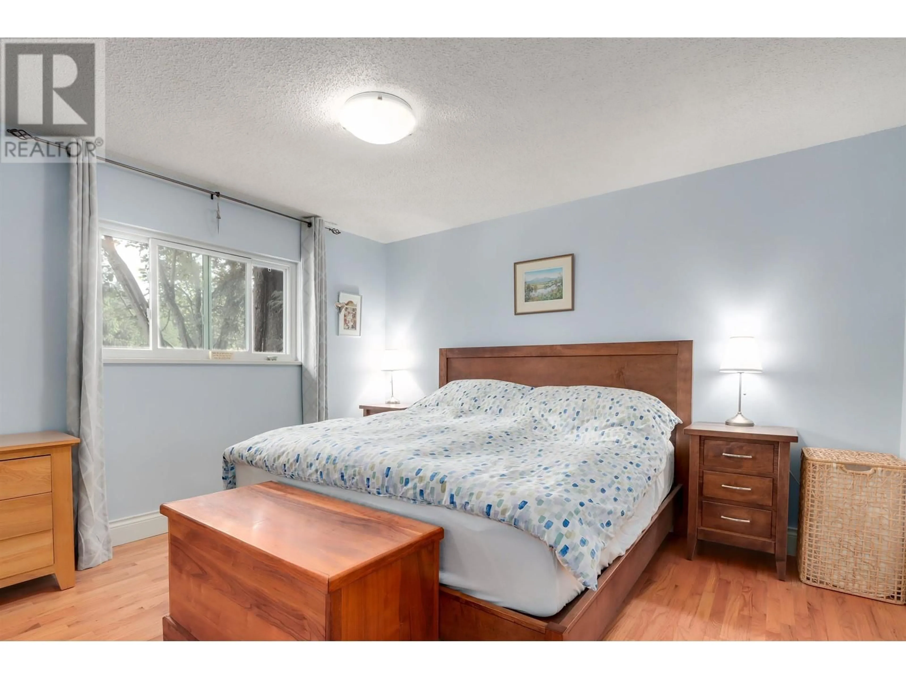 Bedroom with bed, wood/laminate floor for 999 FREDERICK ROAD, North Vancouver British Columbia V7K1H7