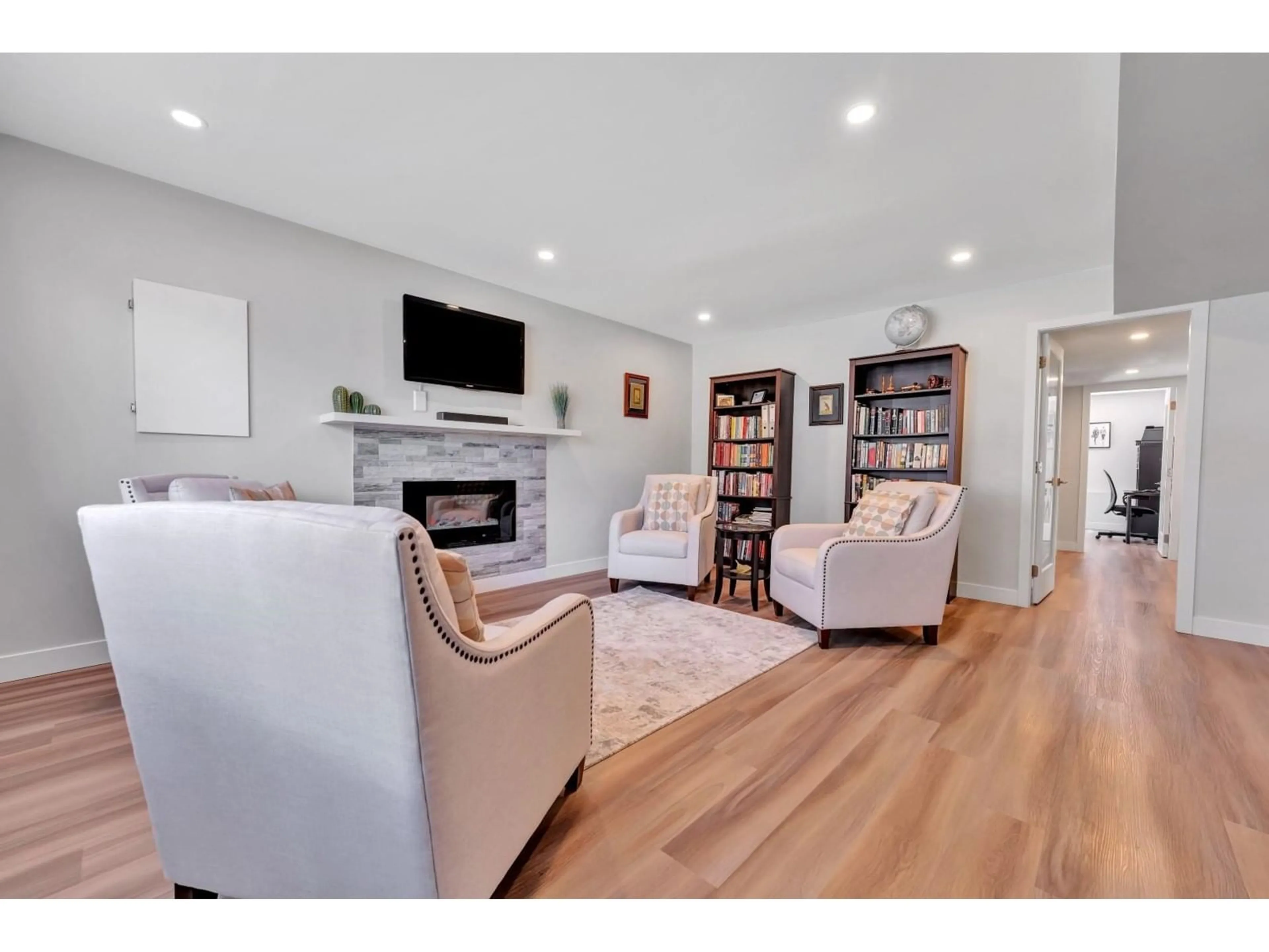 Living room with furniture, wood/laminate floor for 7614 CARNABY, Delta British Columbia V4C7X2