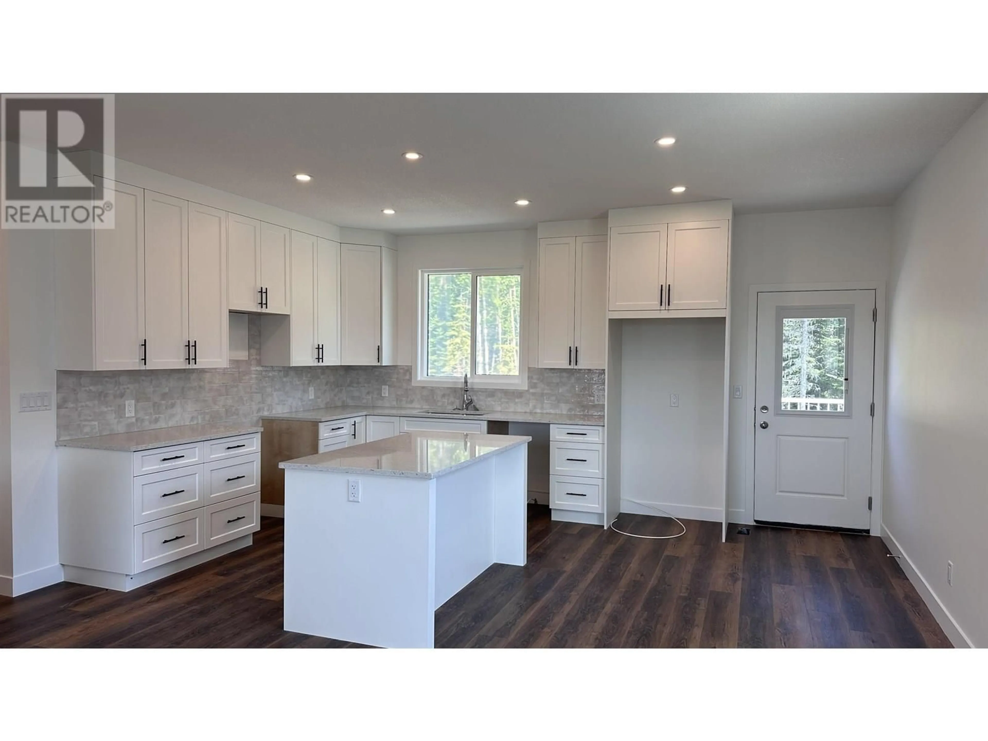 Open concept kitchen, wood/laminate floor for 7136 HILLU ROAD, Prince George British Columbia V2K0B4