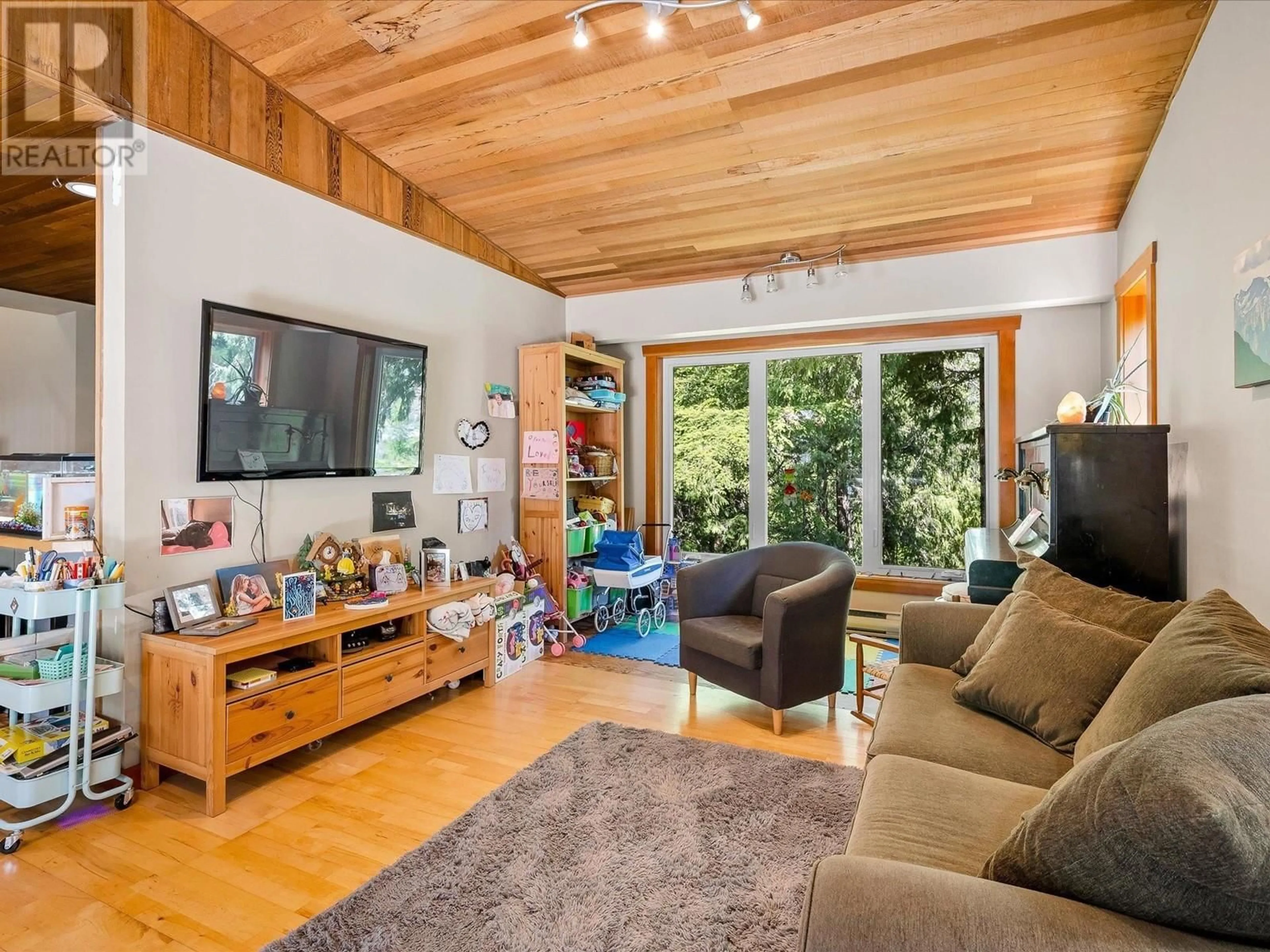 Living room with furniture, wood/laminate floor for 1349 ELMWOOD DRIVE, Pemberton British Columbia V0N2L0