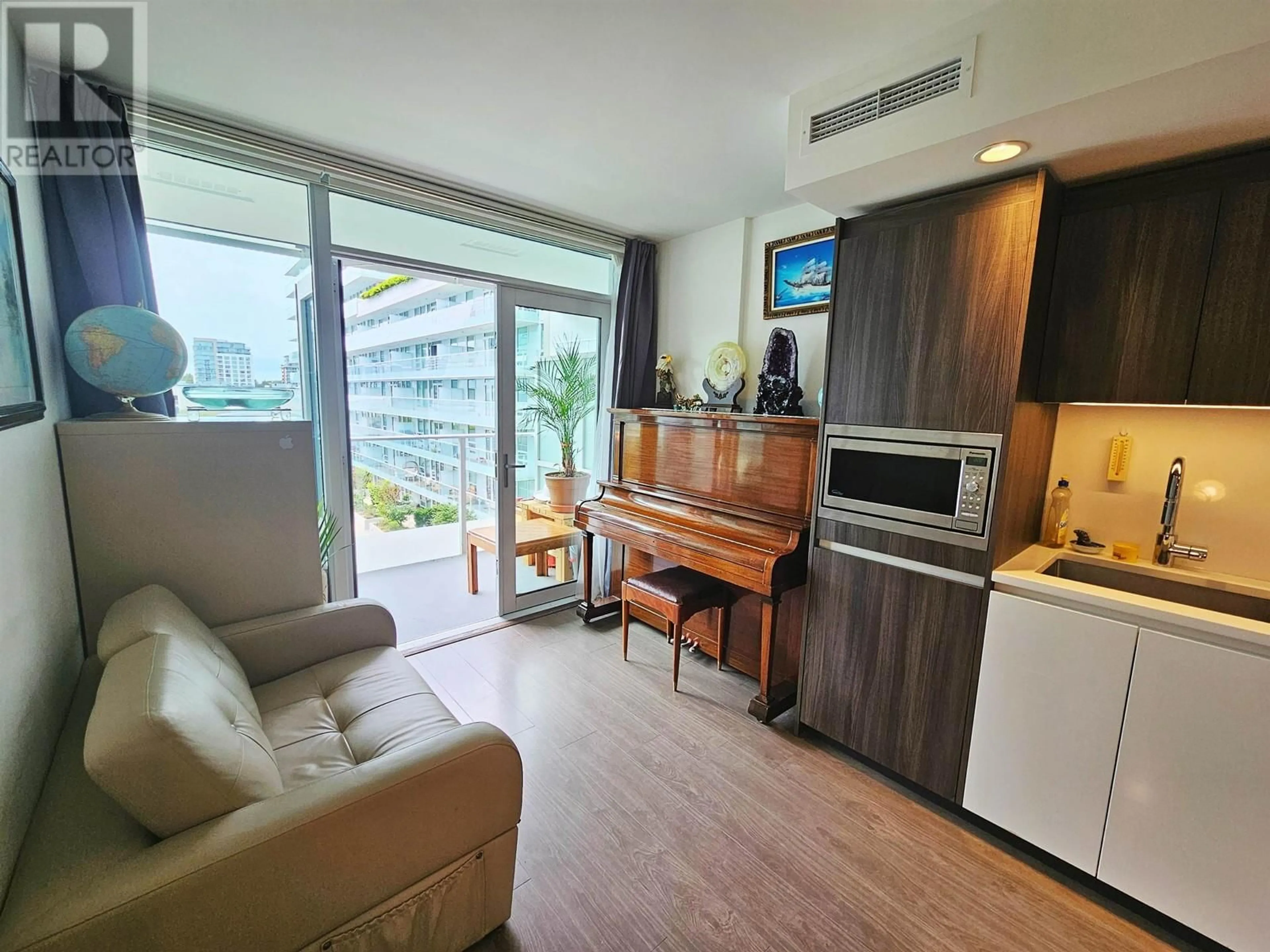 Living room with furniture, wood/laminate floor for 651 - 6328 NO. 3 ROAD, Richmond British Columbia V6Y0L6