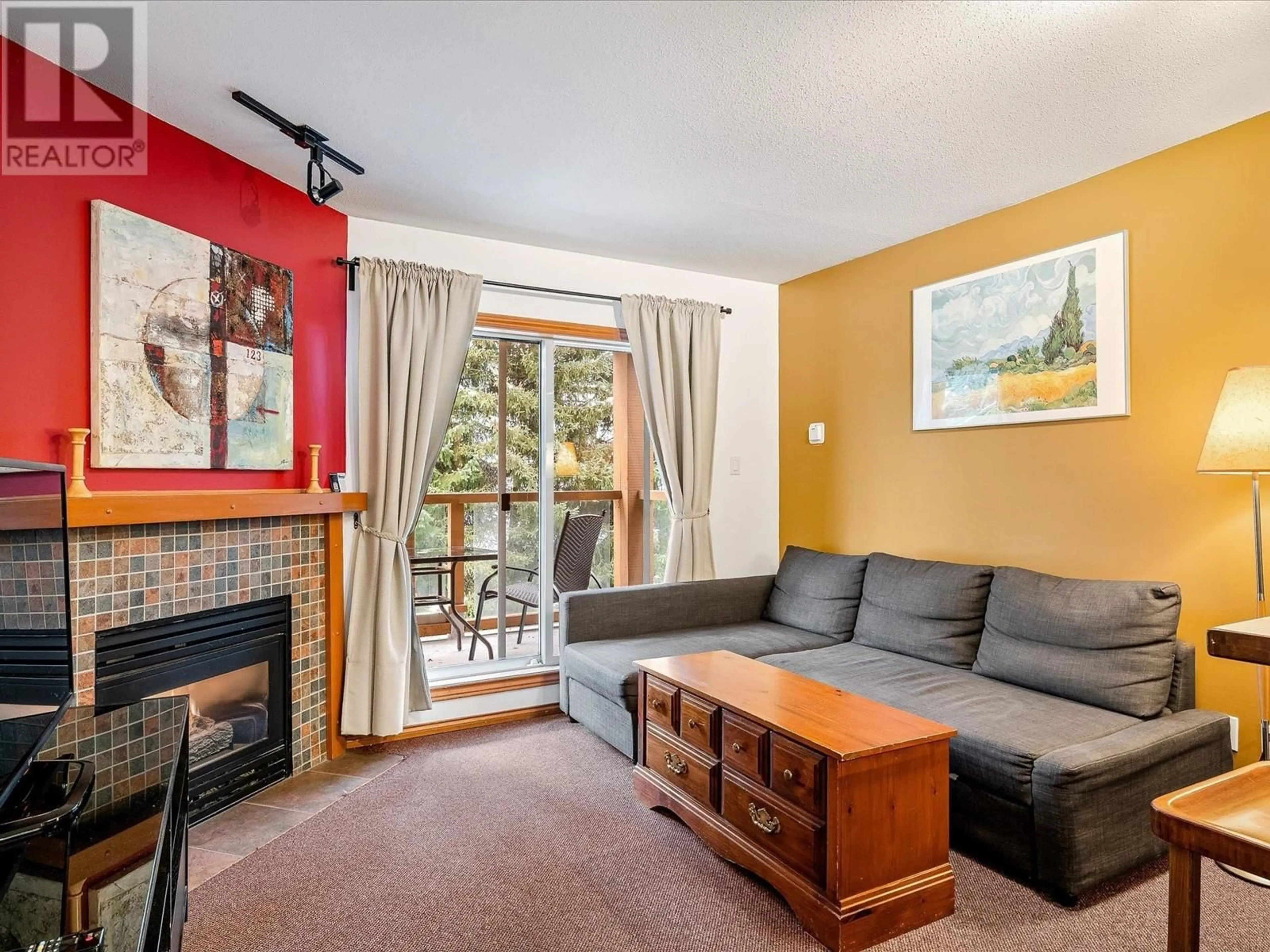 Living room with furniture, wood/laminate floor for 112 - 4388 NORTHLANDS BOULEVARD, Whistler British Columbia V0N1B4