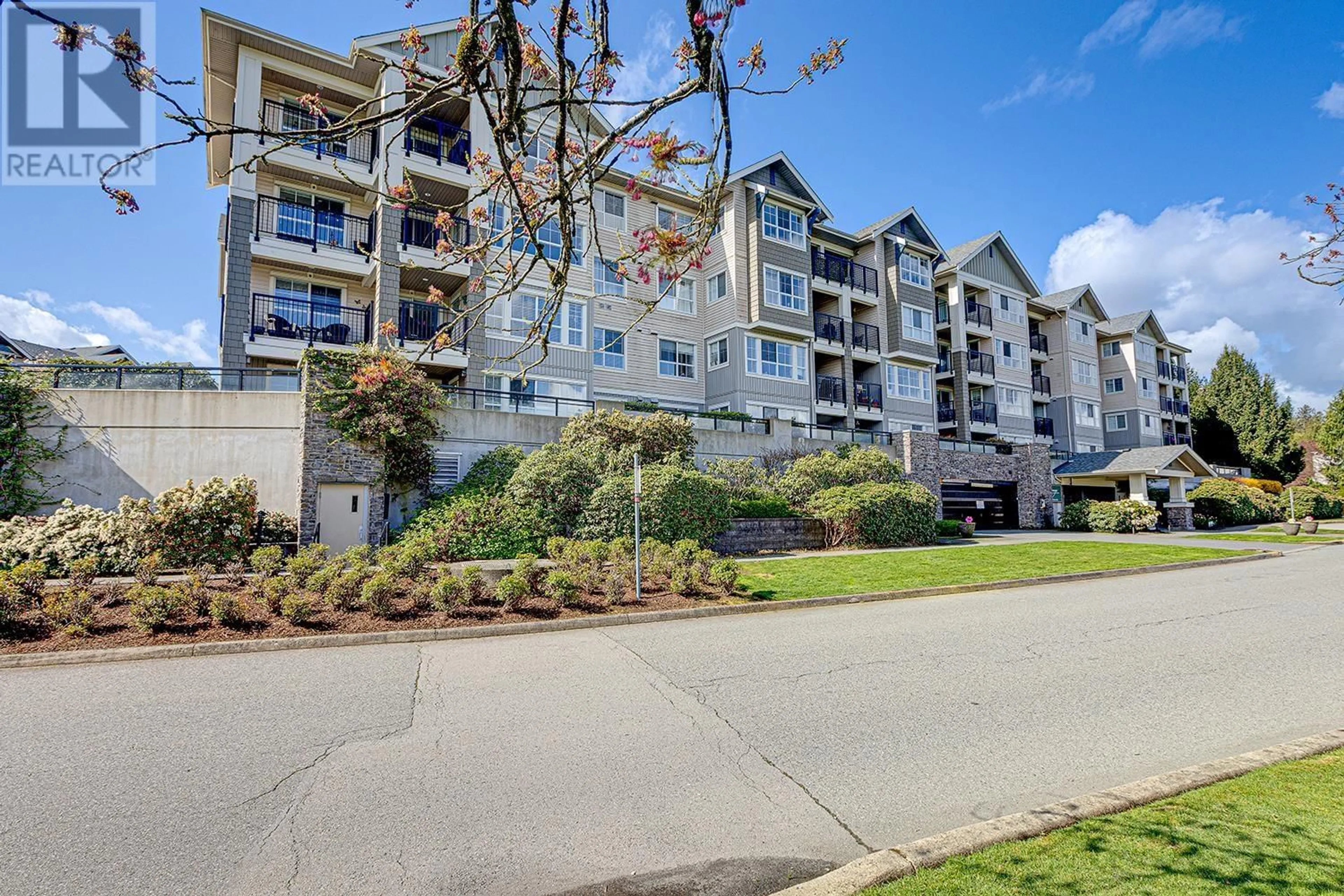 A pic from outside/outdoor area/front of a property/back of a property/a pic from drone, water/lake/river/ocean view for 405 - 19673 MEADOW GARDENS WAY, Pitt Meadows British Columbia V3Y0A1