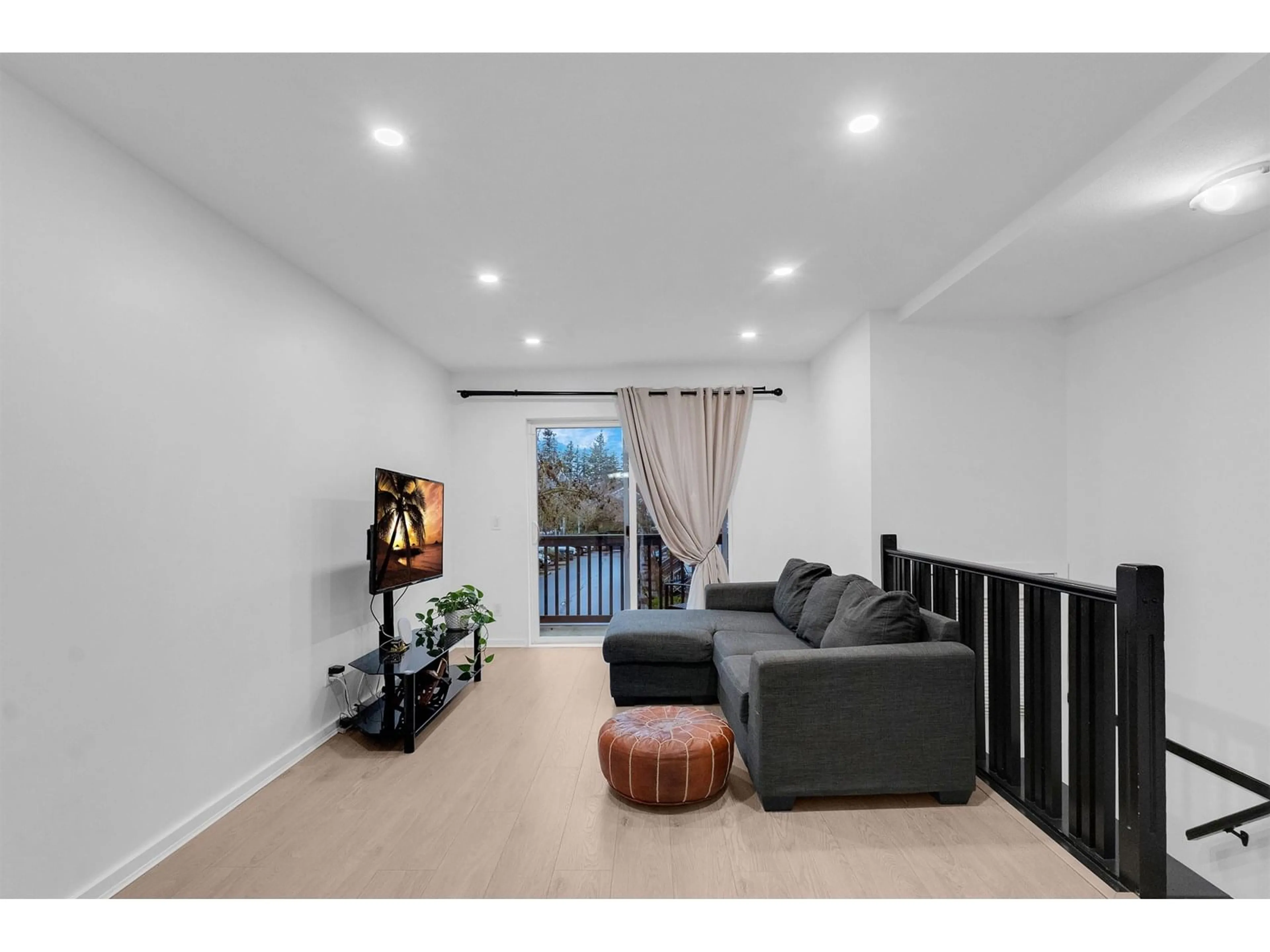 Living room with furniture, wood/laminate floor for 162 - 15236 36, Surrey British Columbia V3Z2B3