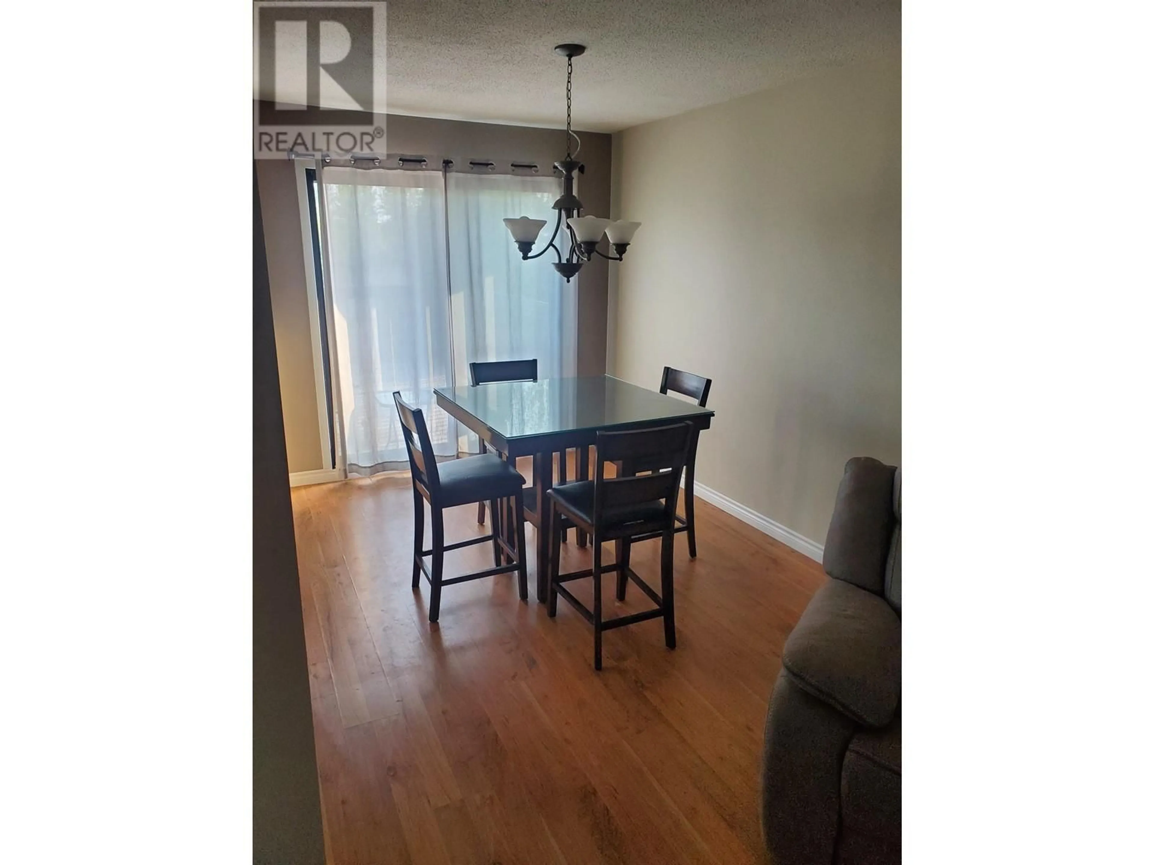 Dining room, wood/laminate floor for 27 MANSON CRESCENT, Mackenzie British Columbia V0J2C0