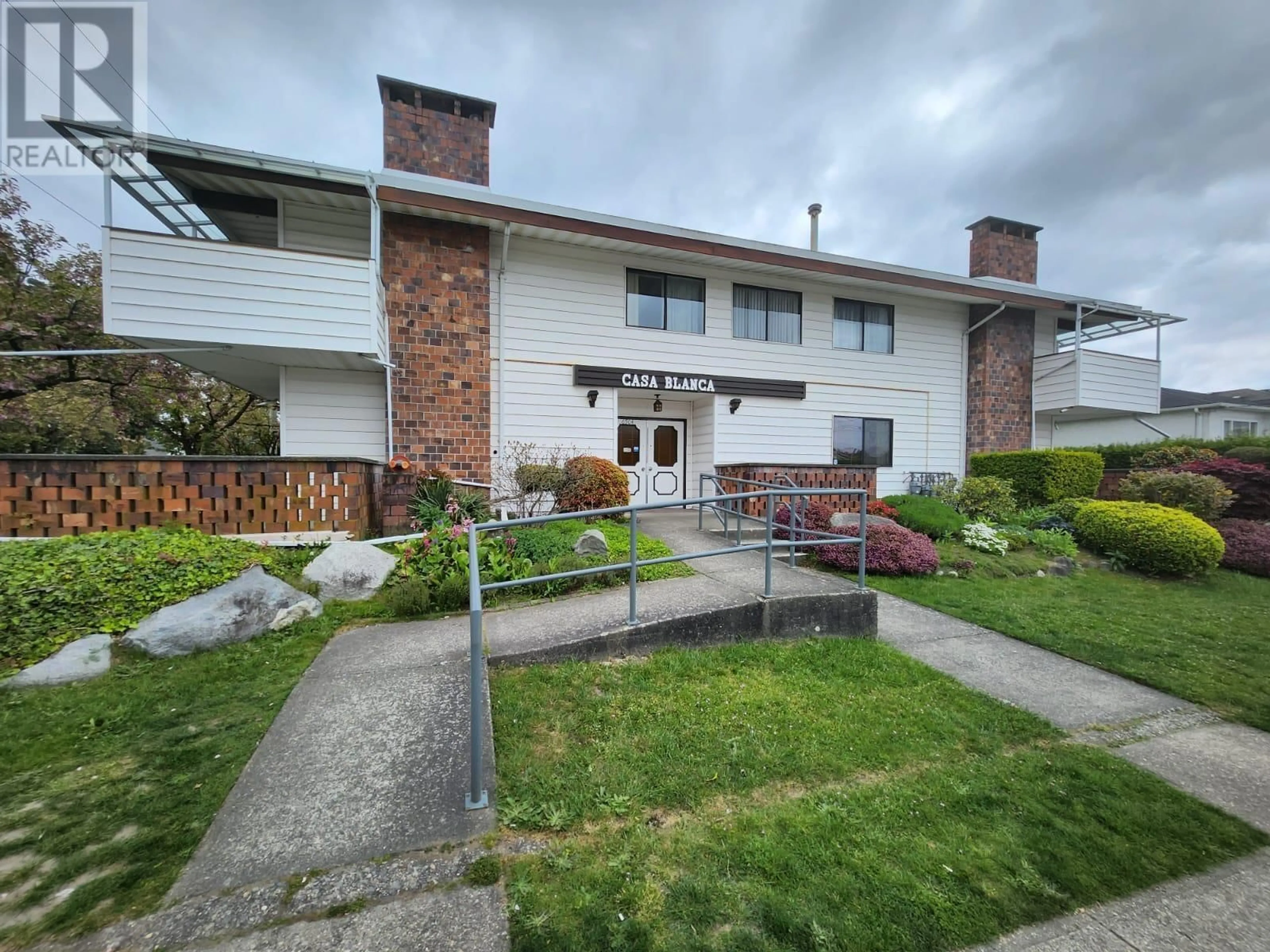 A pic from outside/outdoor area/front of a property/back of a property/a pic from drone, street for 106 - 6904 FRASER STREET, Vancouver British Columbia V5X3V2