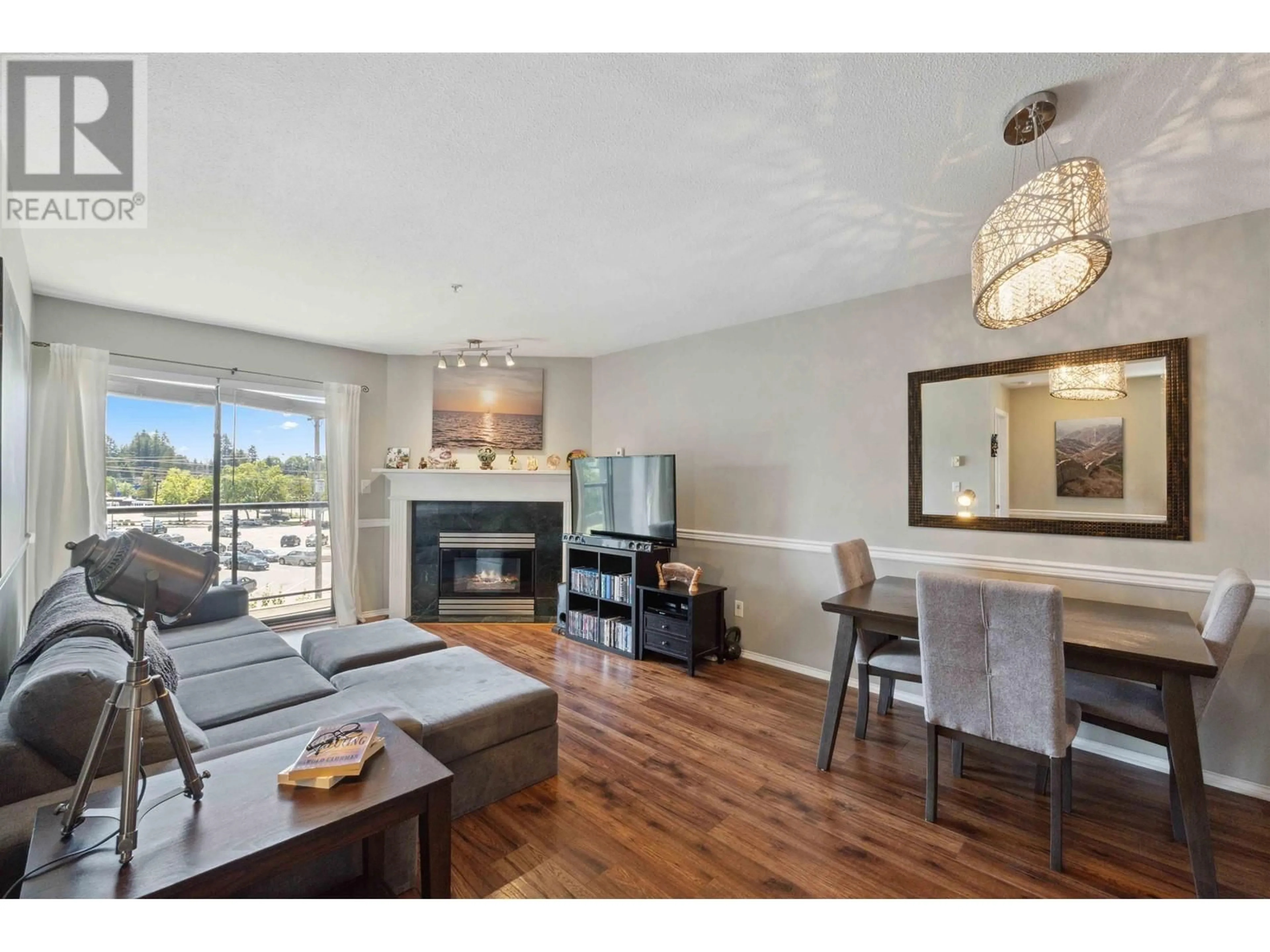 Living room with furniture, wood/laminate floor for 402 - 12025 207A STREET, Maple Ridge British Columbia V2X0R3