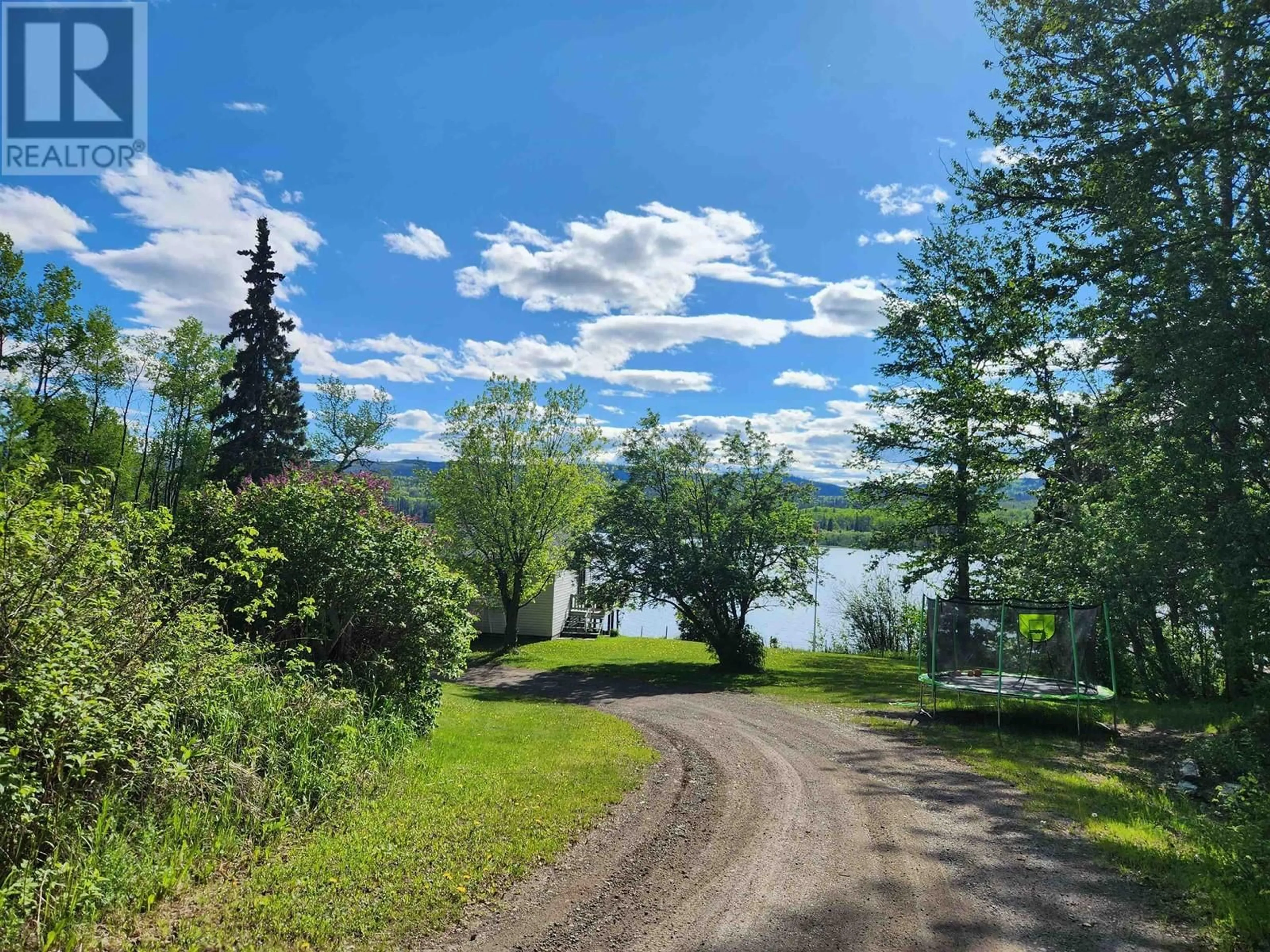 A pic from outside/outdoor area/front of a property/back of a property/a pic from drone, water/lake/river/ocean view for 8003 ROWLAND ROAD, Burns Lake British Columbia V0J1E1