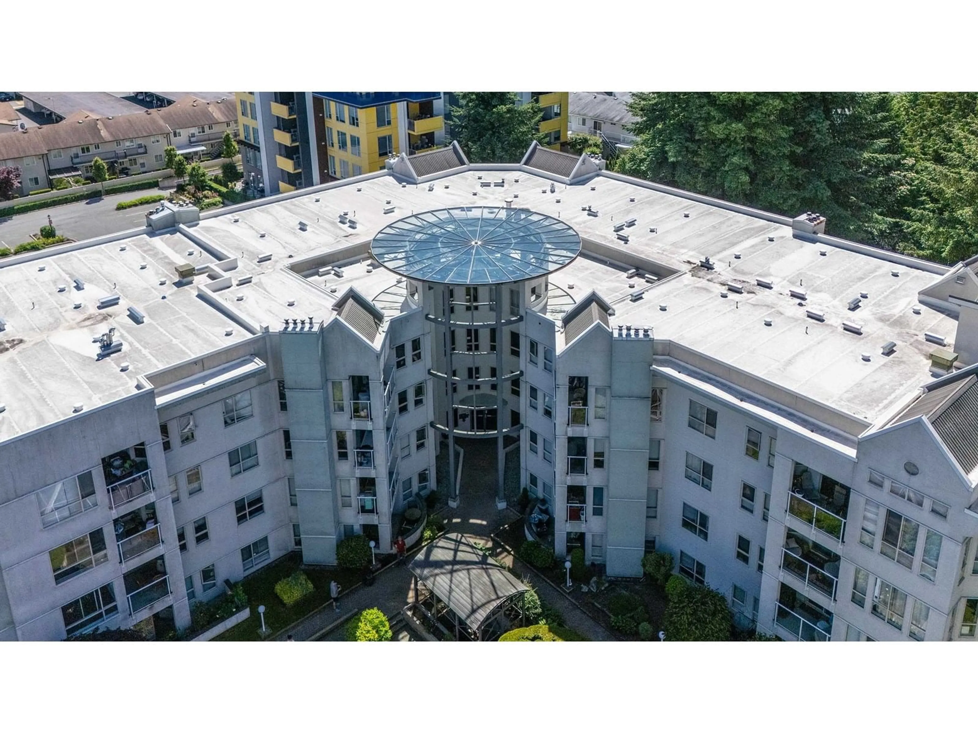 A pic from outside/outdoor area/front of a property/back of a property/a pic from drone, building for 303 - 2575 WARE, Abbotsford British Columbia V2S3E2