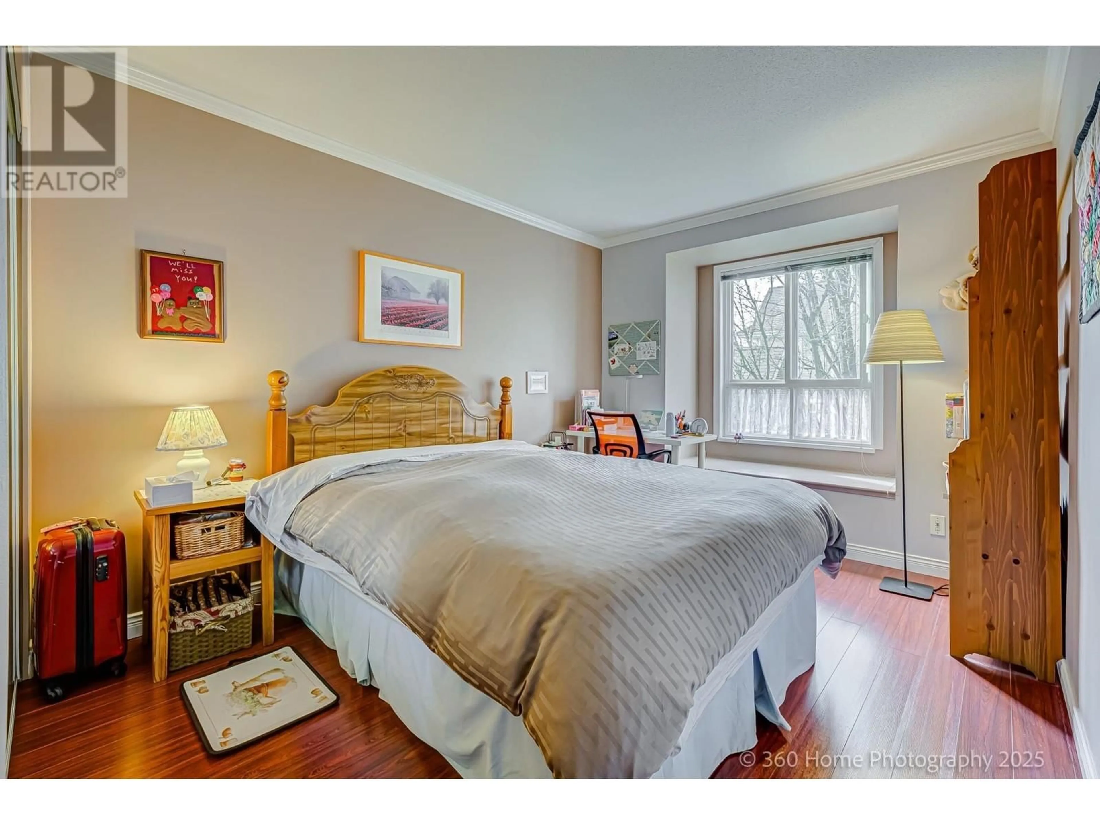 Bedroom with bed, wood/laminate floor for 307 - 8495 JELLICOE STREET, Vancouver British Columbia V5S2J4