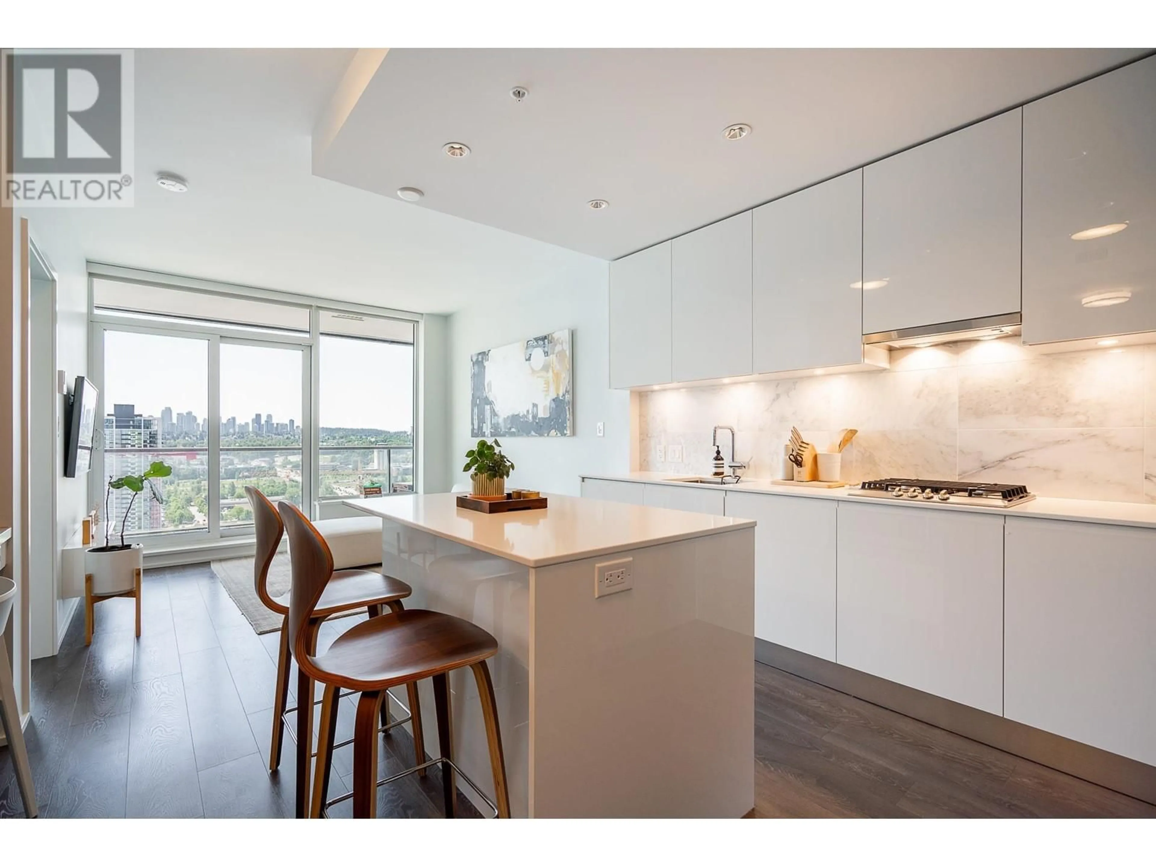 Open concept kitchen, wood/laminate floor for 1505 - 1955 ALPHA WAY, Burnaby British Columbia V5C0K6