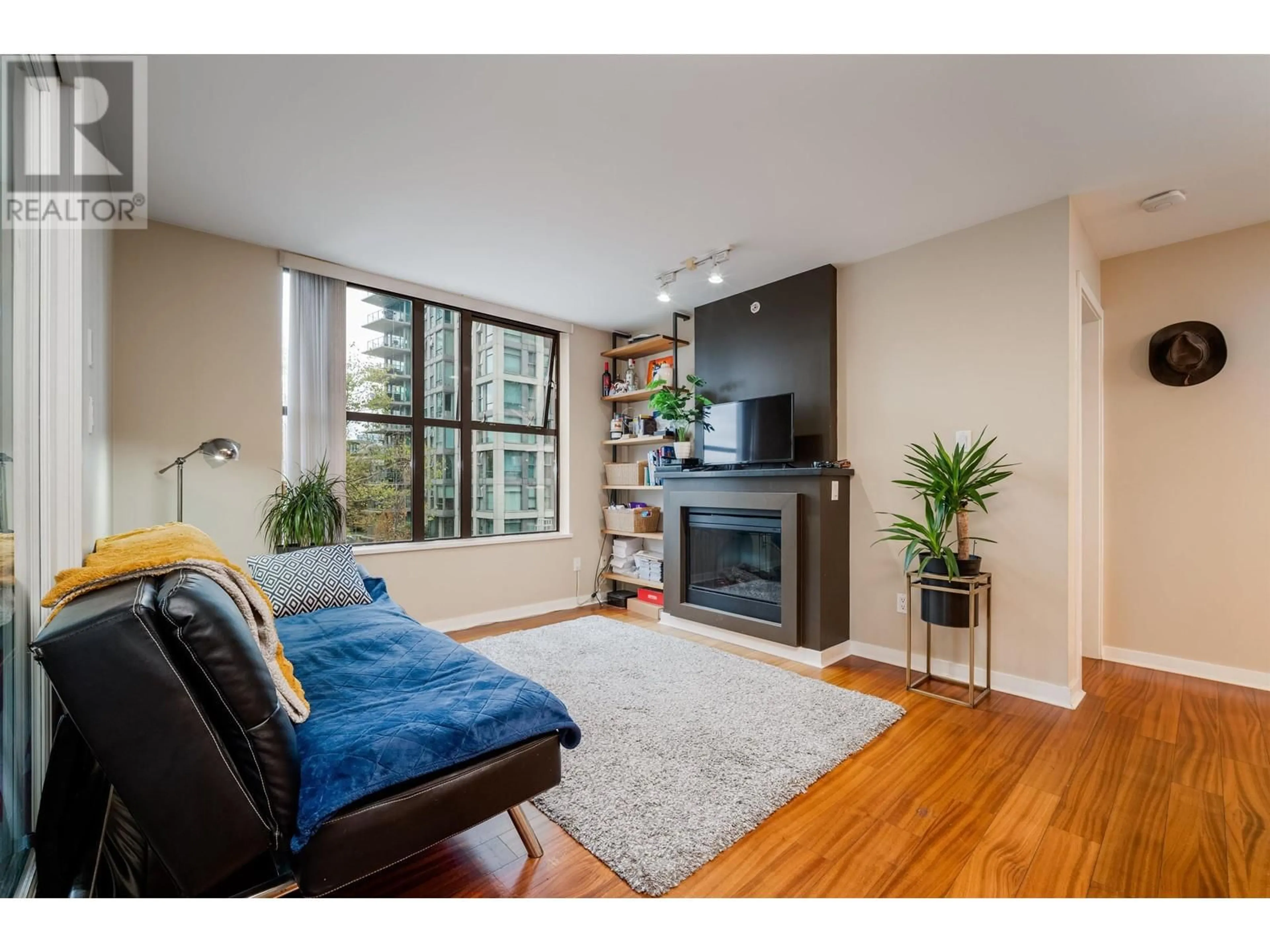 Living room with furniture, wood/laminate floor for 506 - 989 BEATTY STREET, Vancouver British Columbia V6Z3C2