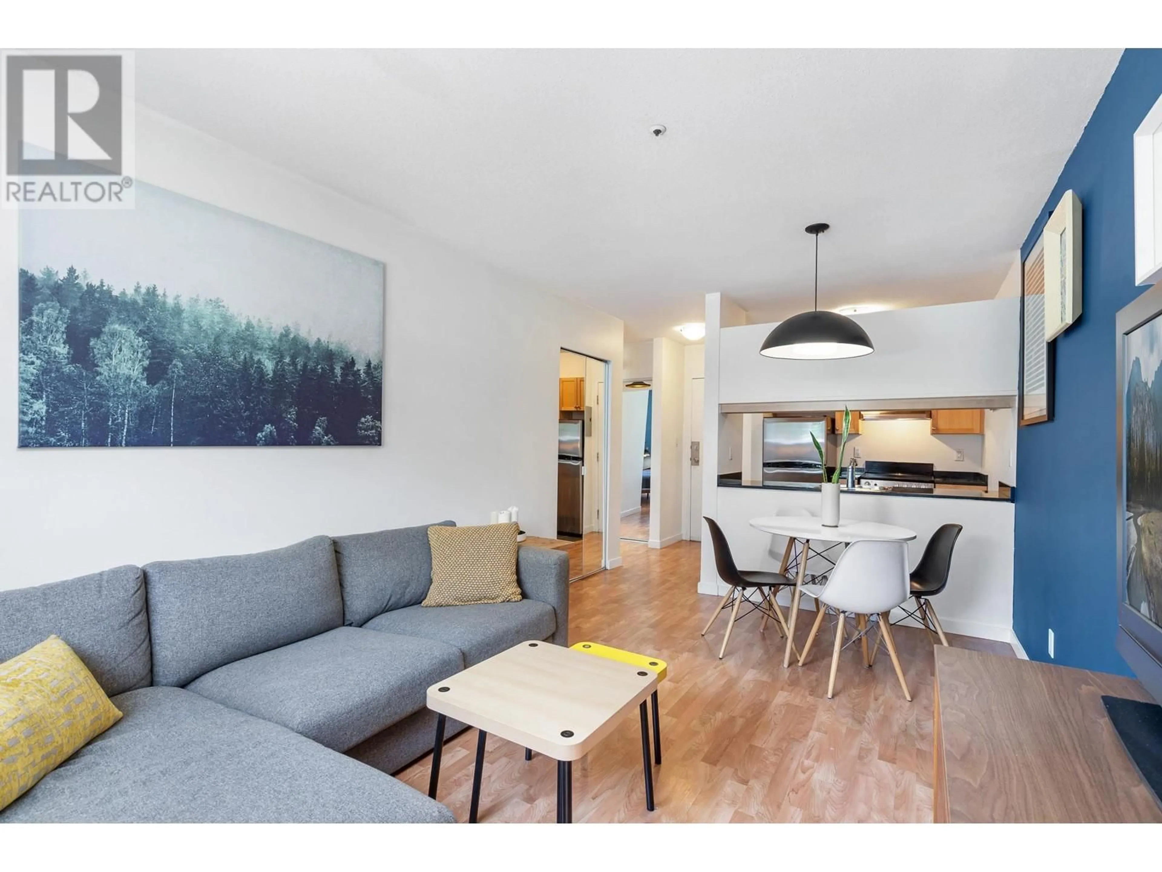 Living room with furniture, wood/laminate floor for 105 - 33 TEMPLETON DRIVE, Vancouver British Columbia V5L3C9