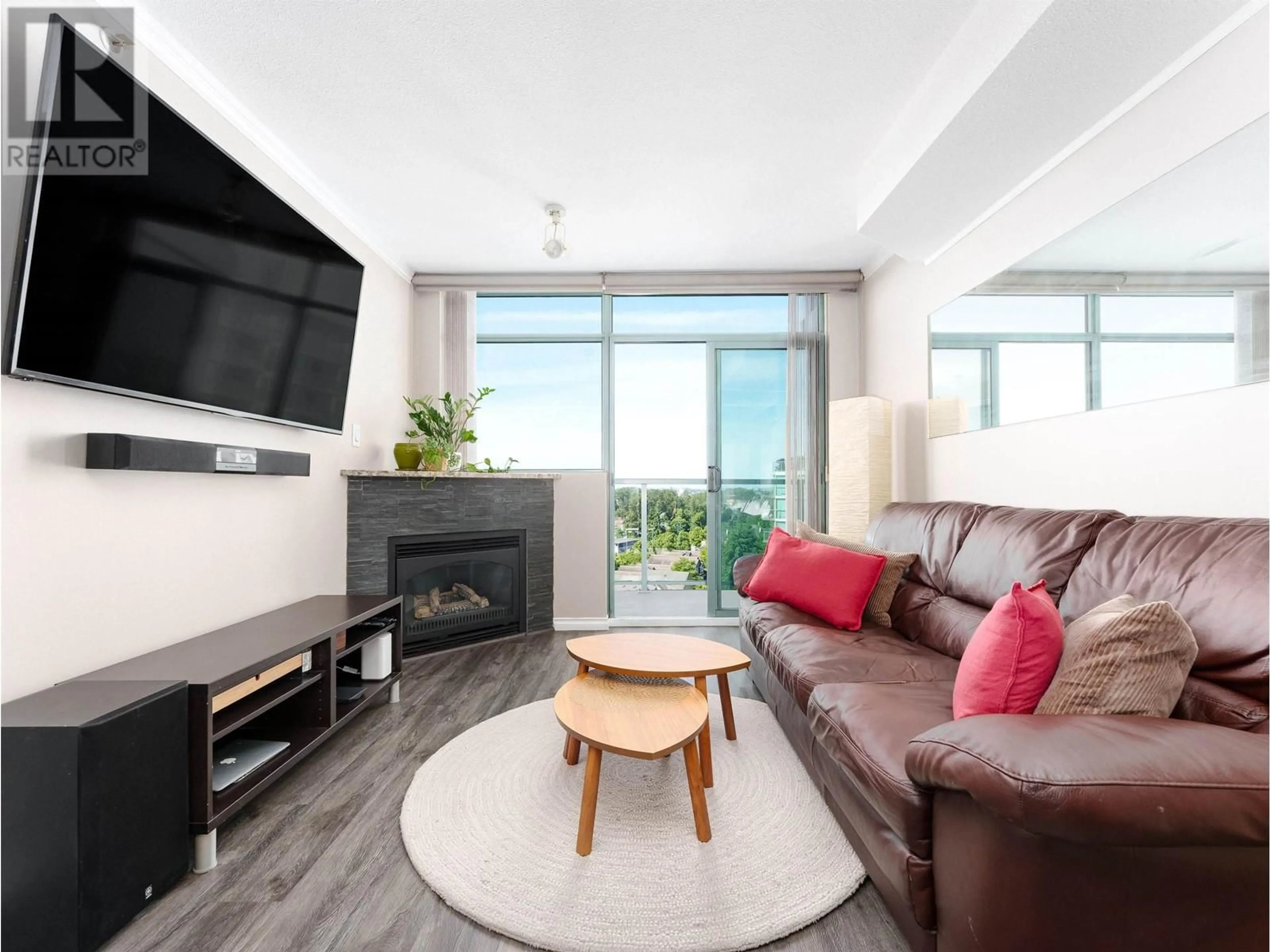 Living room with furniture, wood/laminate floor for 1105 - 2763 CHANDLERY PLACE, Vancouver British Columbia V5S4V4