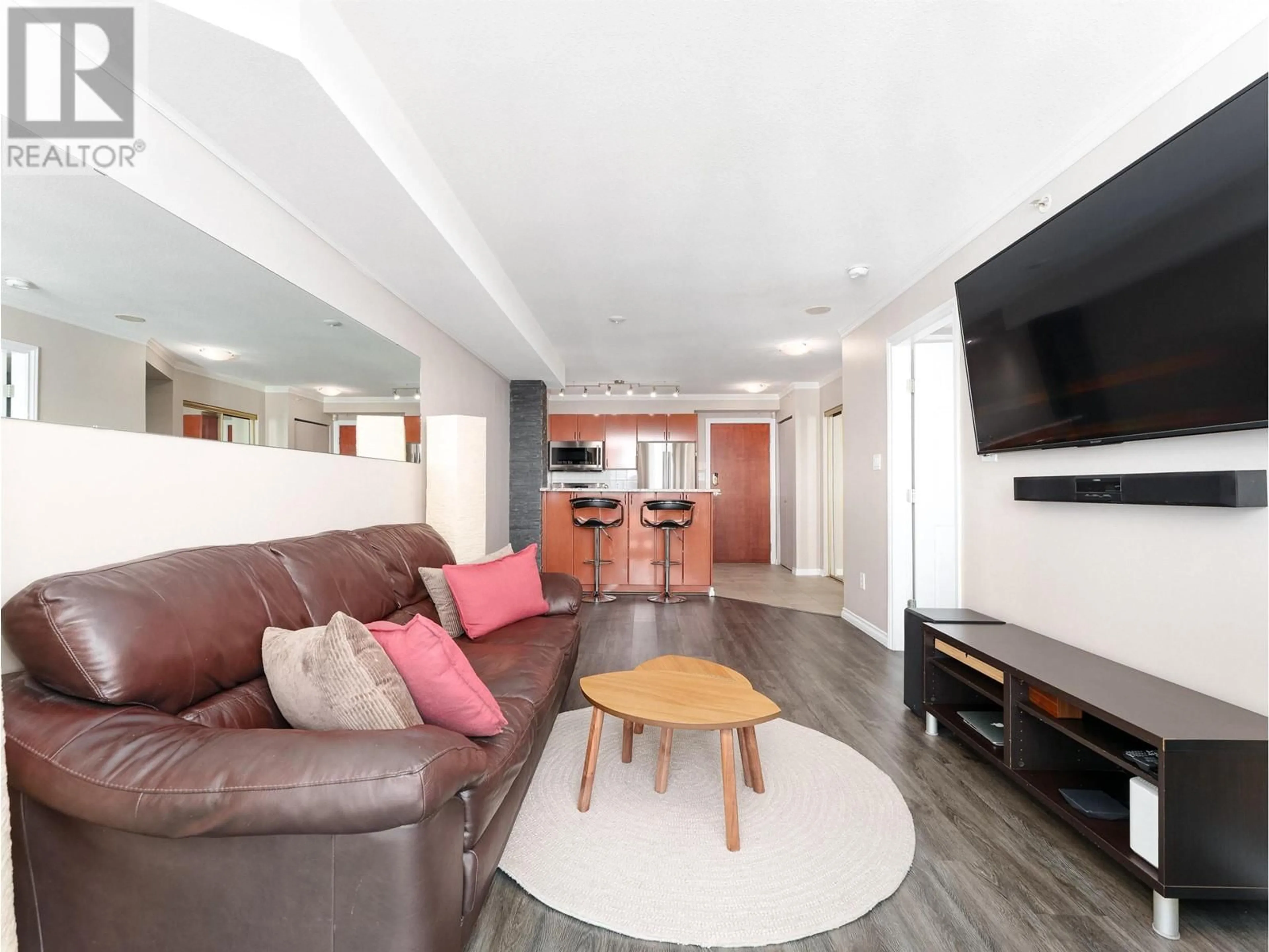 Living room with furniture, wood/laminate floor for 1105 - 2763 CHANDLERY PLACE, Vancouver British Columbia V5S4V4