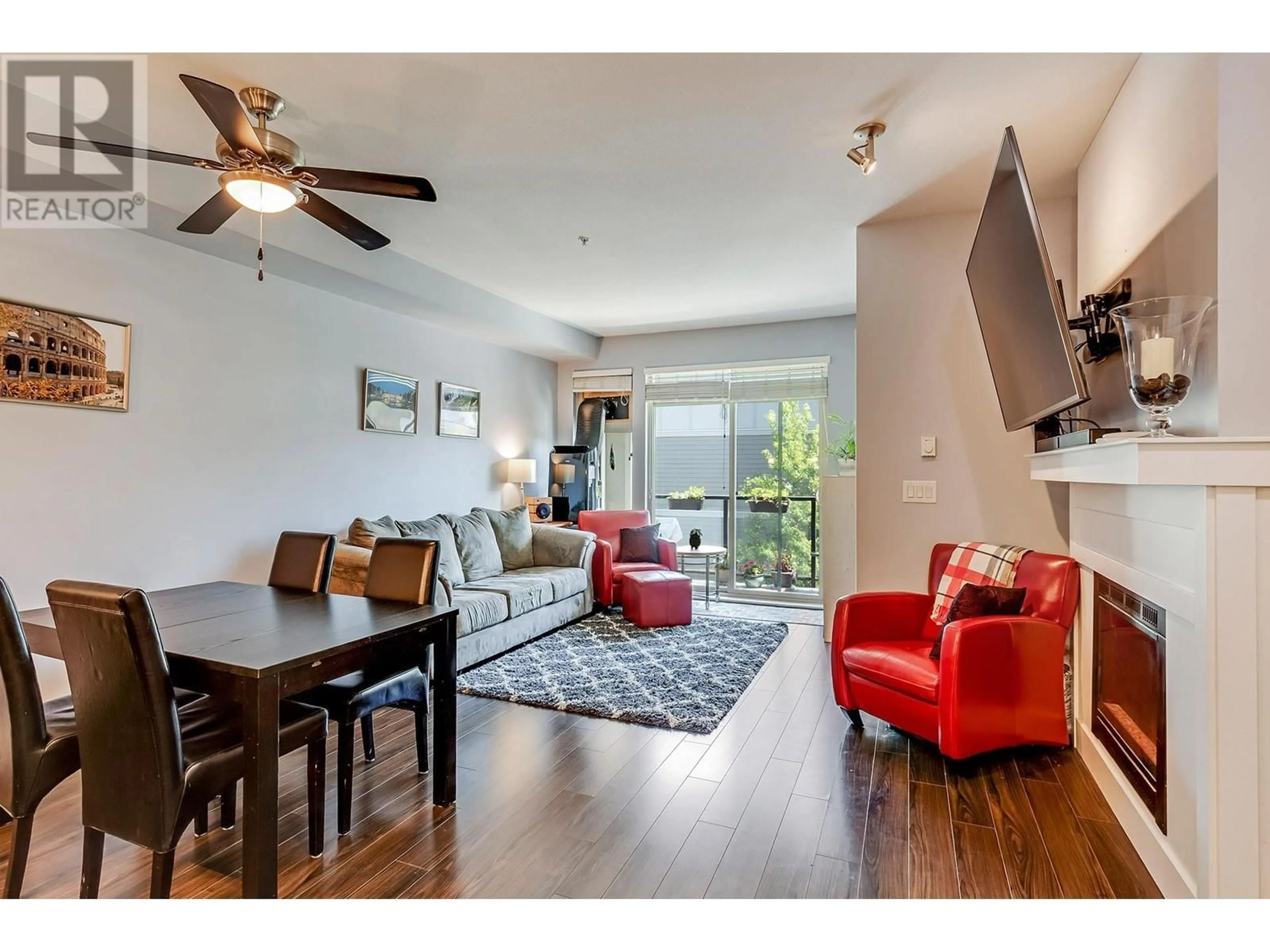 Living room with furniture, wood/laminate floor for 309 - 2330 SHAUGHNESSY STREET, Port Coquitlam British Columbia V5C0B5