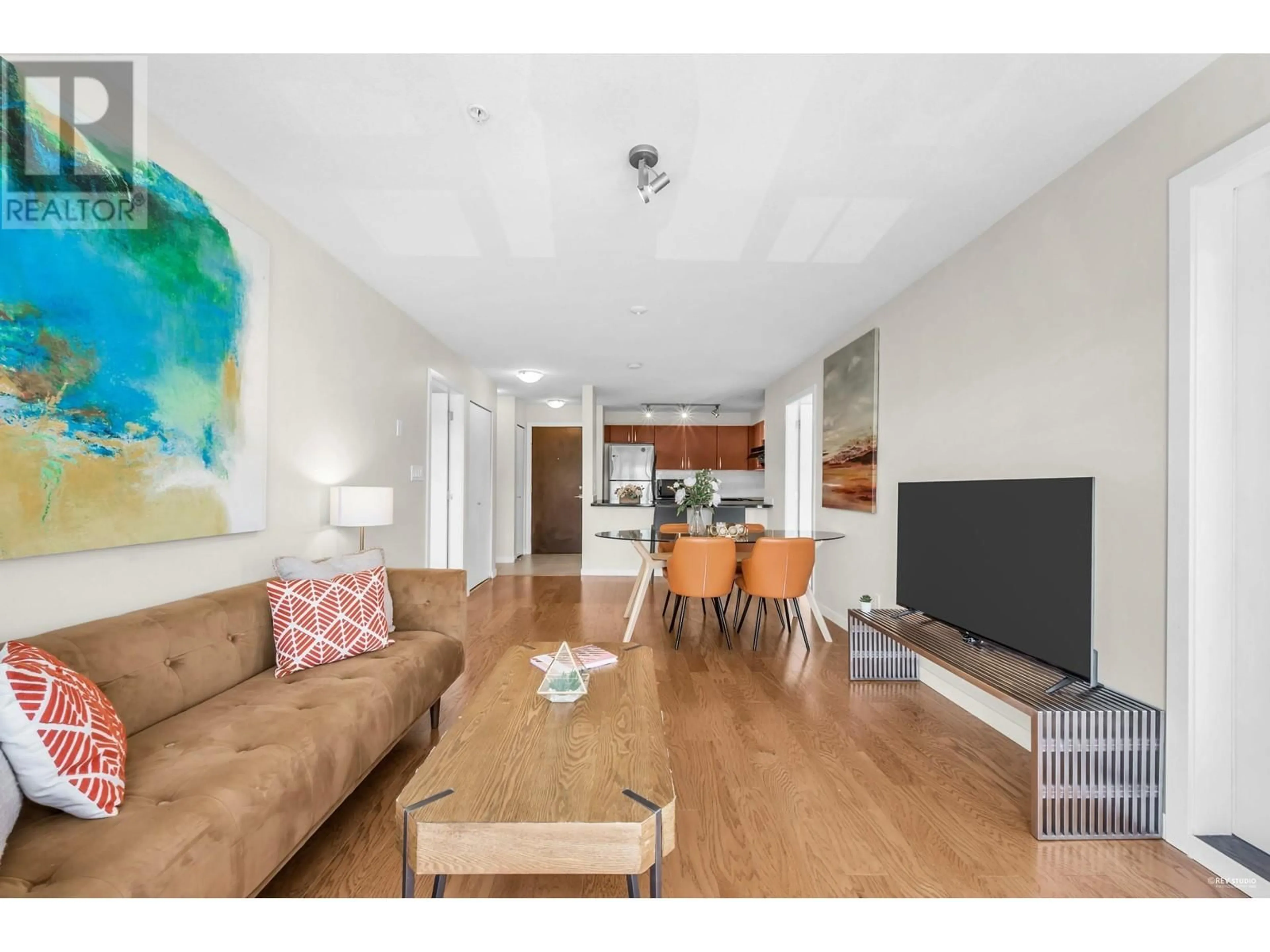 Living room with furniture, wood/laminate floor for 302 - 7339 MACPHERSON AVENUE, Burnaby British Columbia V5J0B1