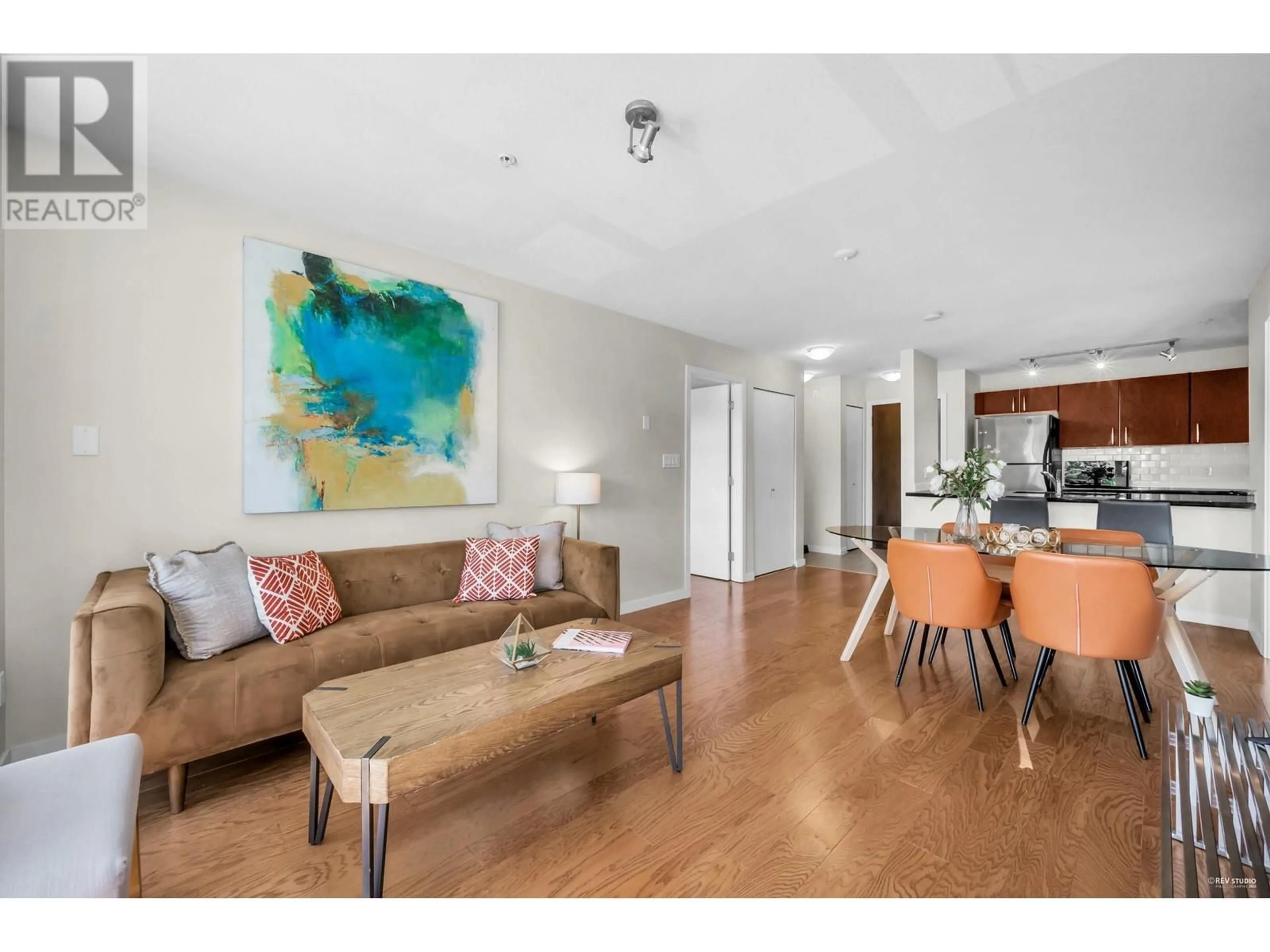 Living room with furniture, wood/laminate floor for 302 - 7339 MACPHERSON AVENUE, Burnaby British Columbia V5J0B1