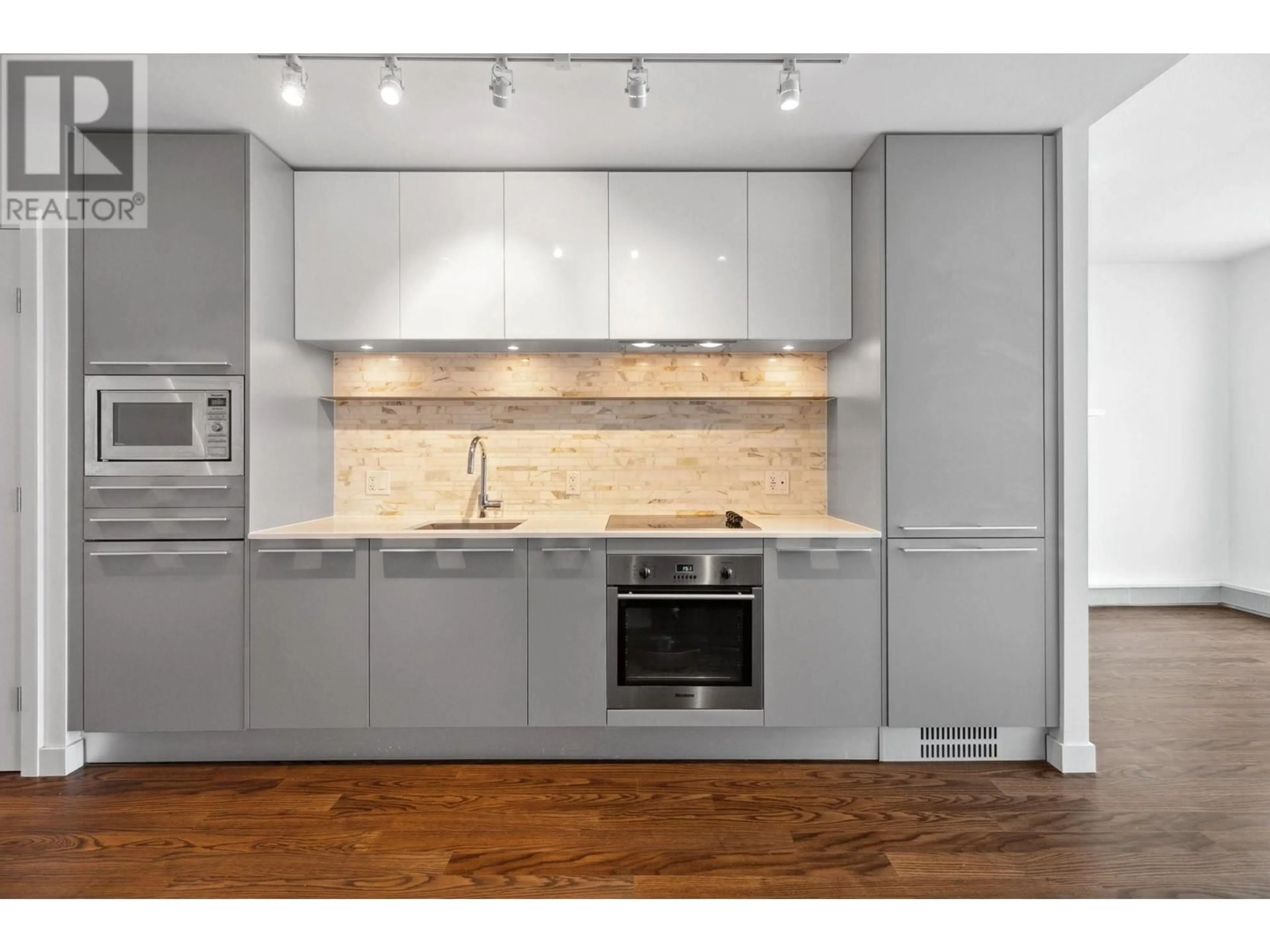 Open concept kitchen, wood/laminate floor for 3003 - 8131 NUNAVUT LANE, Vancouver British Columbia V5X0E2