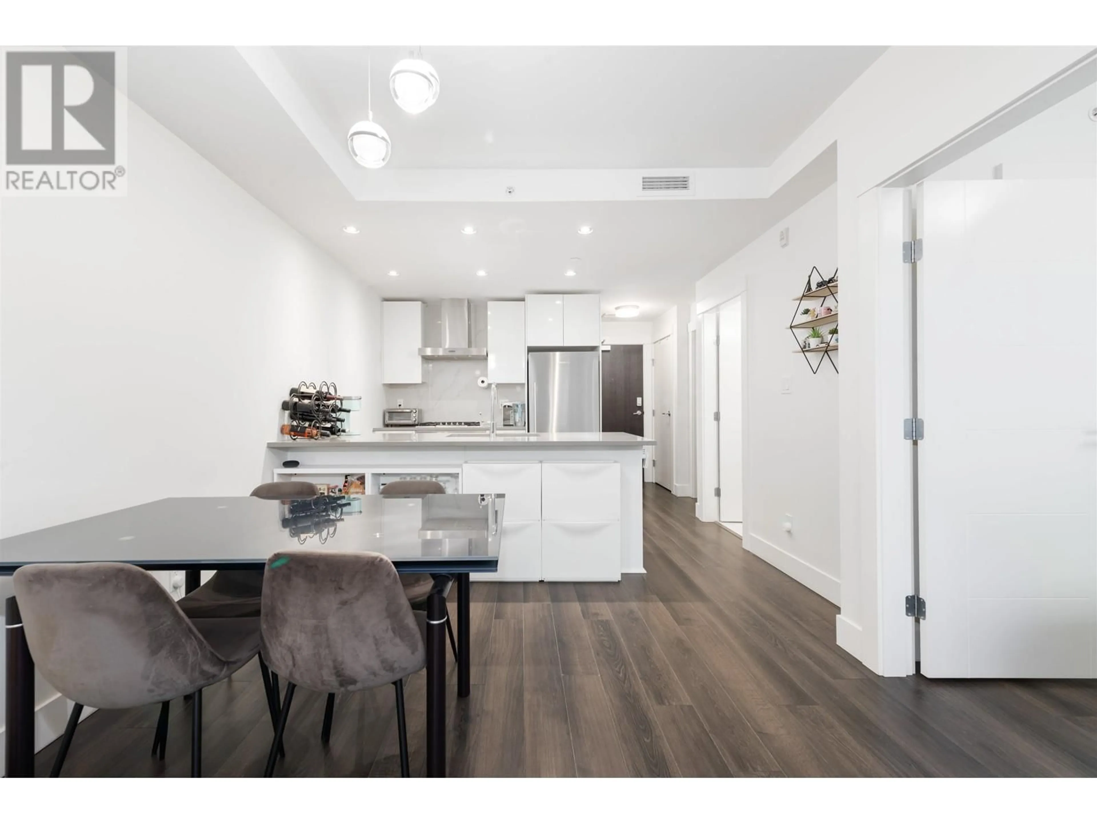 Open concept kitchen, wood/laminate floor for 507 - 10780 NO. 5 ROAD, Richmond British Columbia V6W0B8