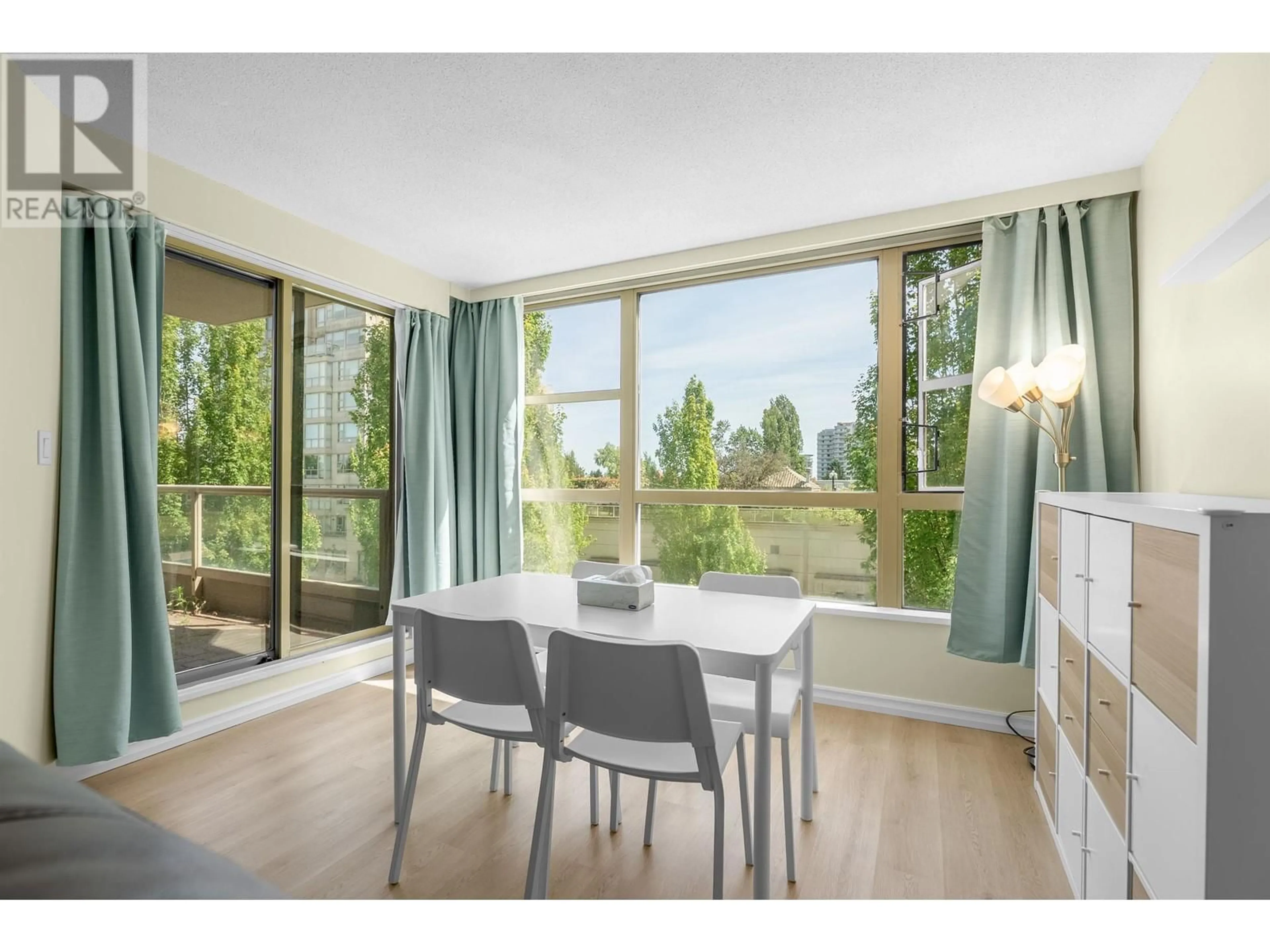Dining room, wood/laminate floor for 405 - 8297 SABA ROAD, Richmond British Columbia V6Y4B5