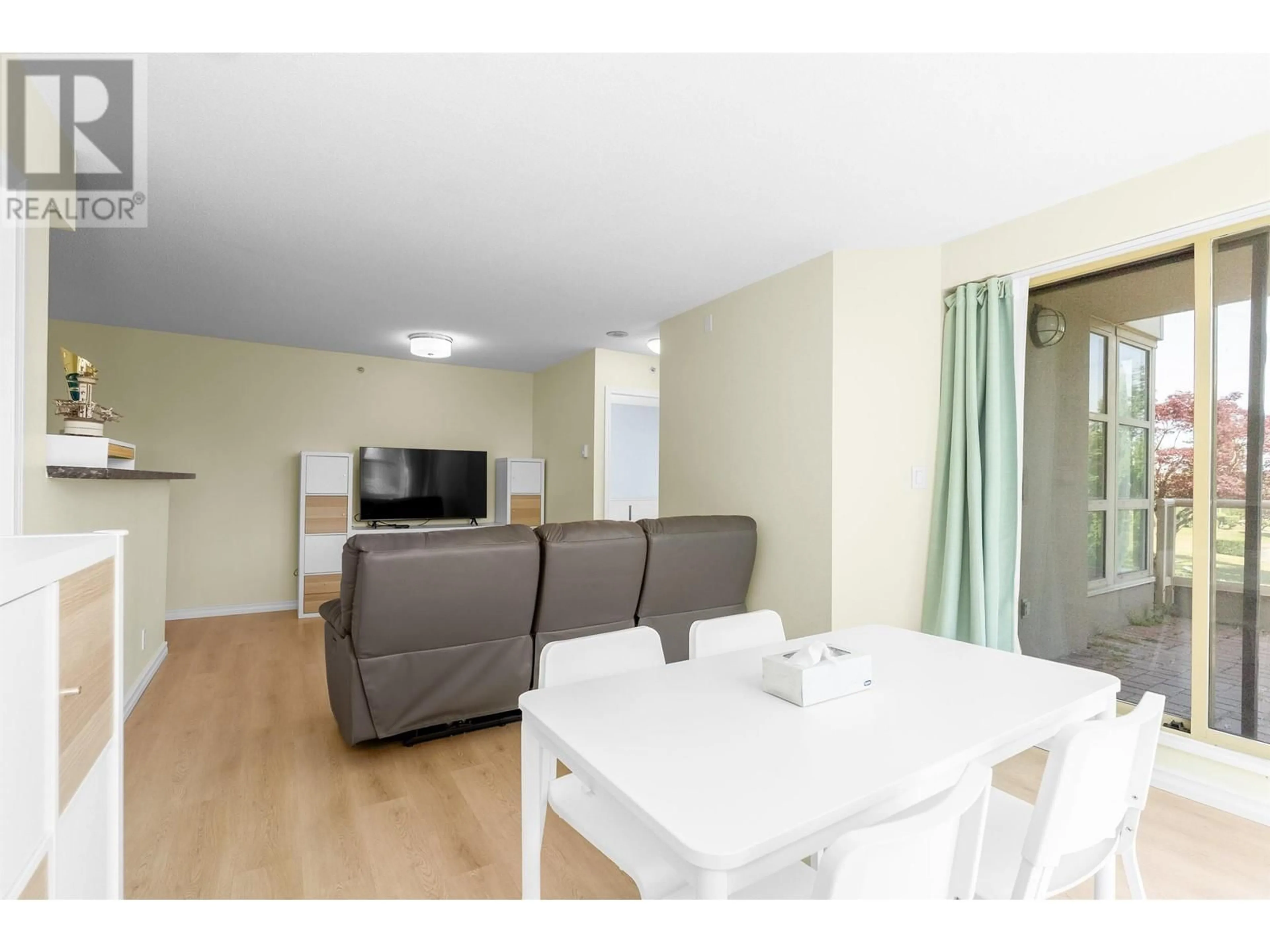 Living room with furniture, wood/laminate floor for 405 - 8297 SABA ROAD, Richmond British Columbia V6Y4B5