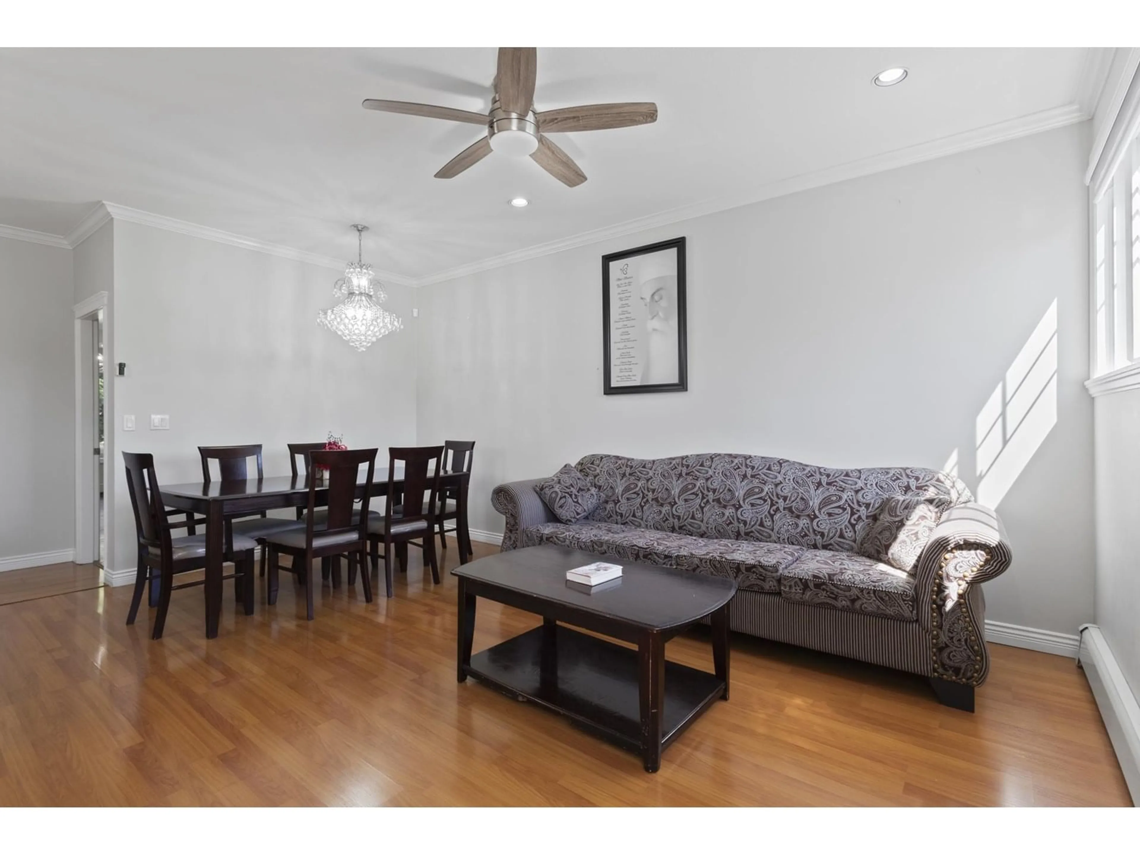 Living room with furniture, wood/laminate floor for 6453 141A, Surrey British Columbia V3W1R5