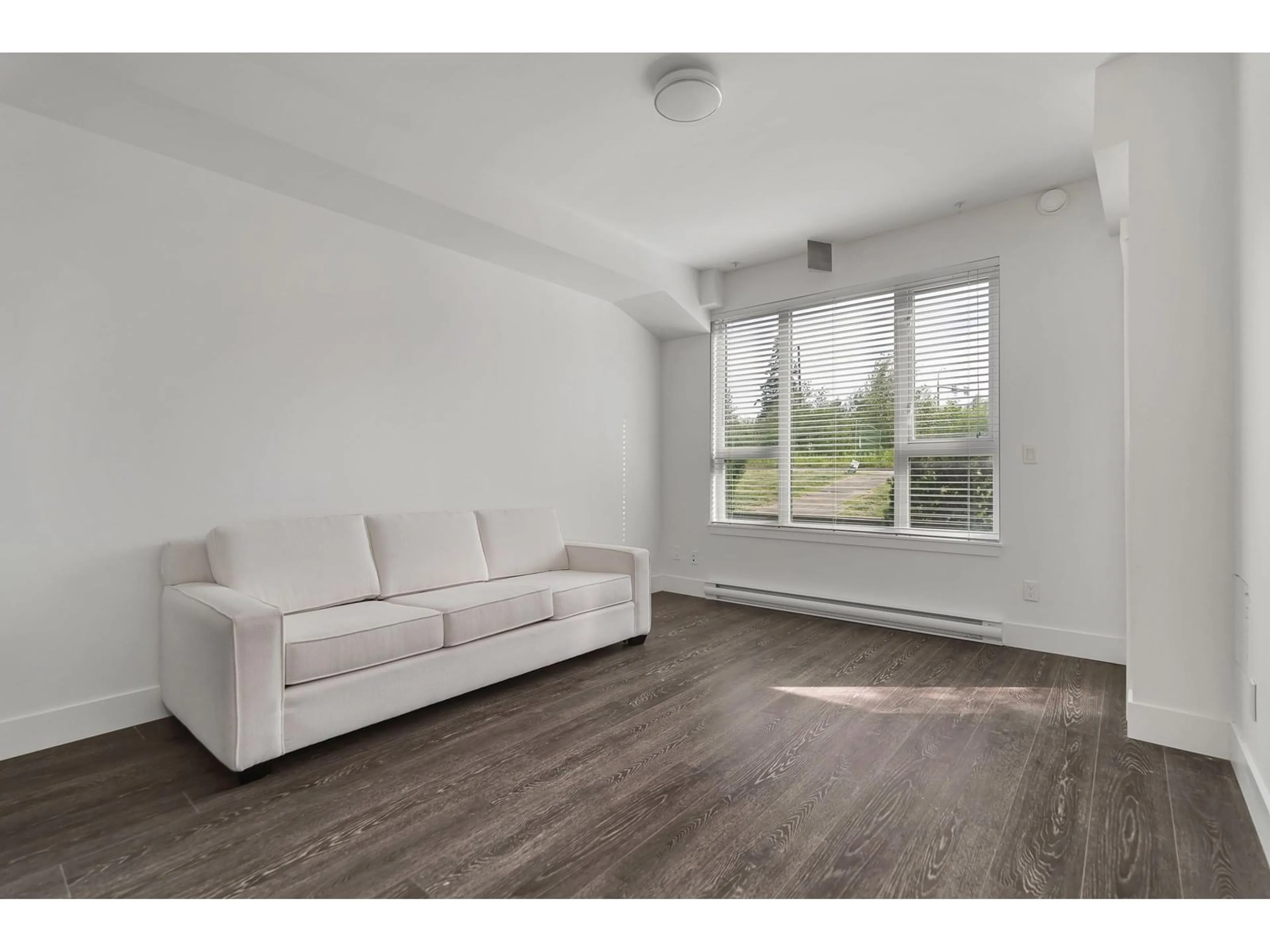 Living room with furniture, wood/laminate floor for 214 - 9983 BARNSTON EAST, Surrey British Columbia V4N6T3