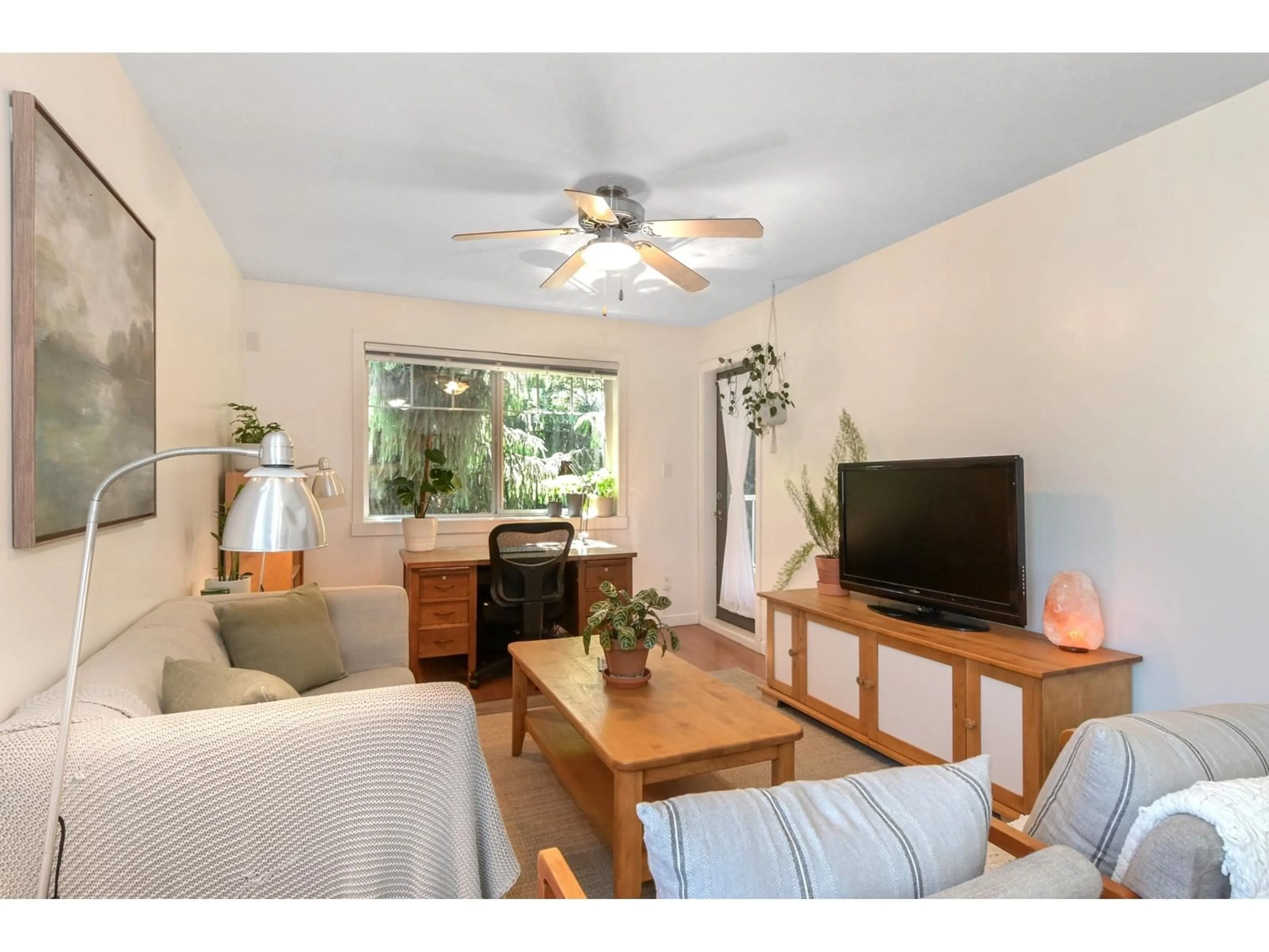 Living room with furniture, wood/laminate floor for 301 - 33960 OLD YALE, Abbotsford British Columbia V2S2J9