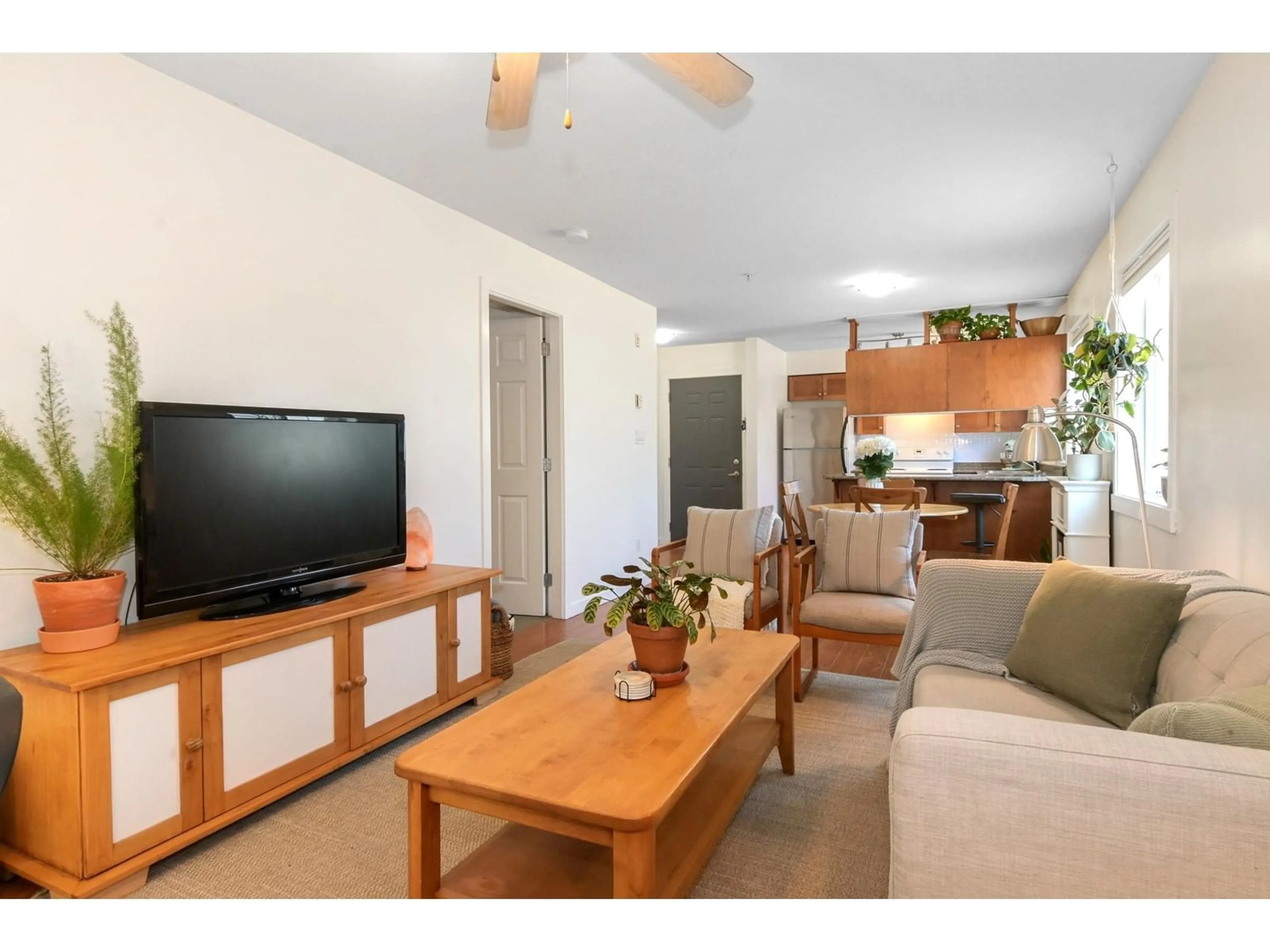 Living room with furniture, wood/laminate floor for 301 - 33960 OLD YALE, Abbotsford British Columbia V2S2J9
