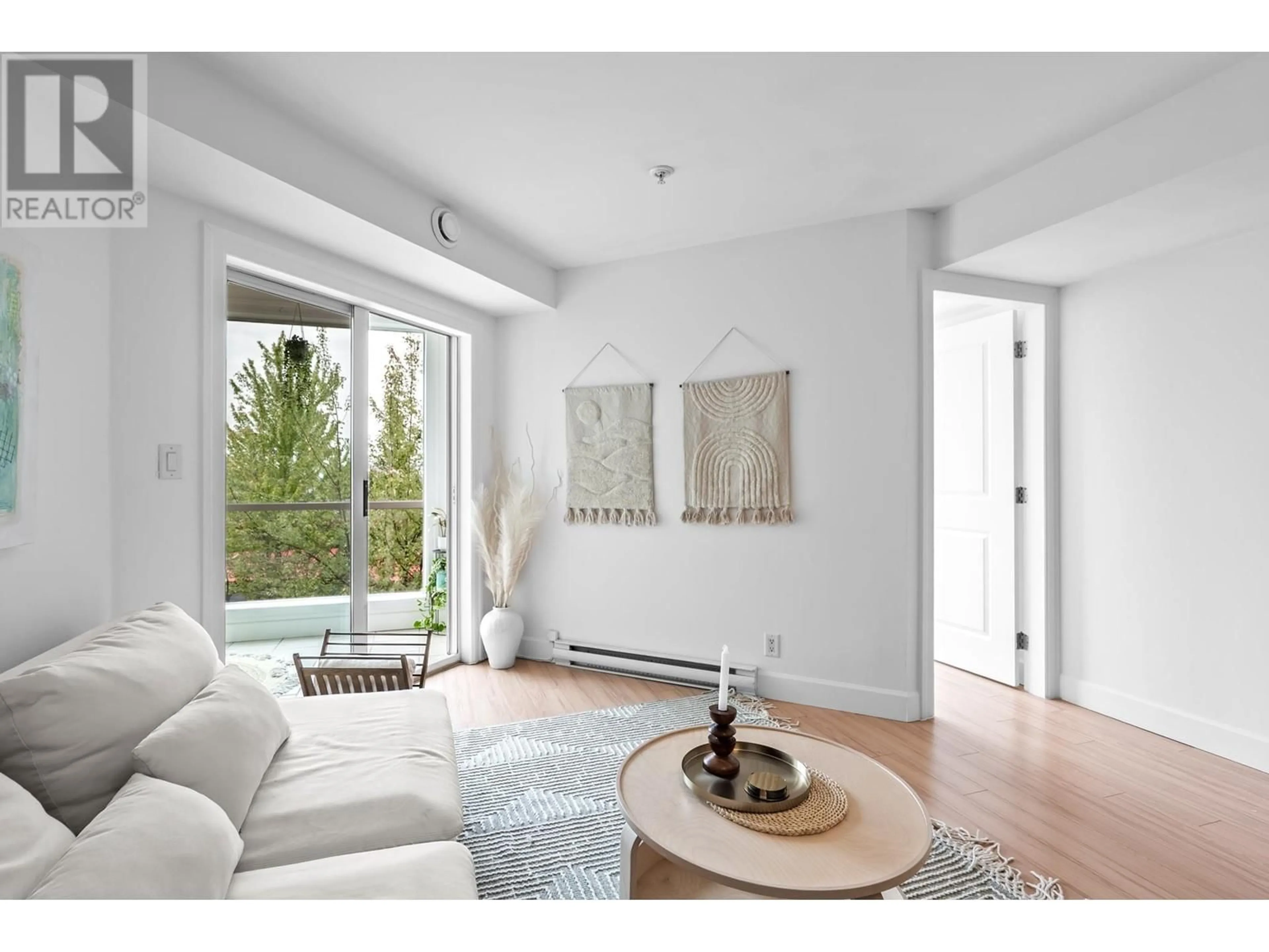 Living room with furniture, wood/laminate floor for 303 - 1718 VENABLES STREET, Vancouver British Columbia V5L2H4