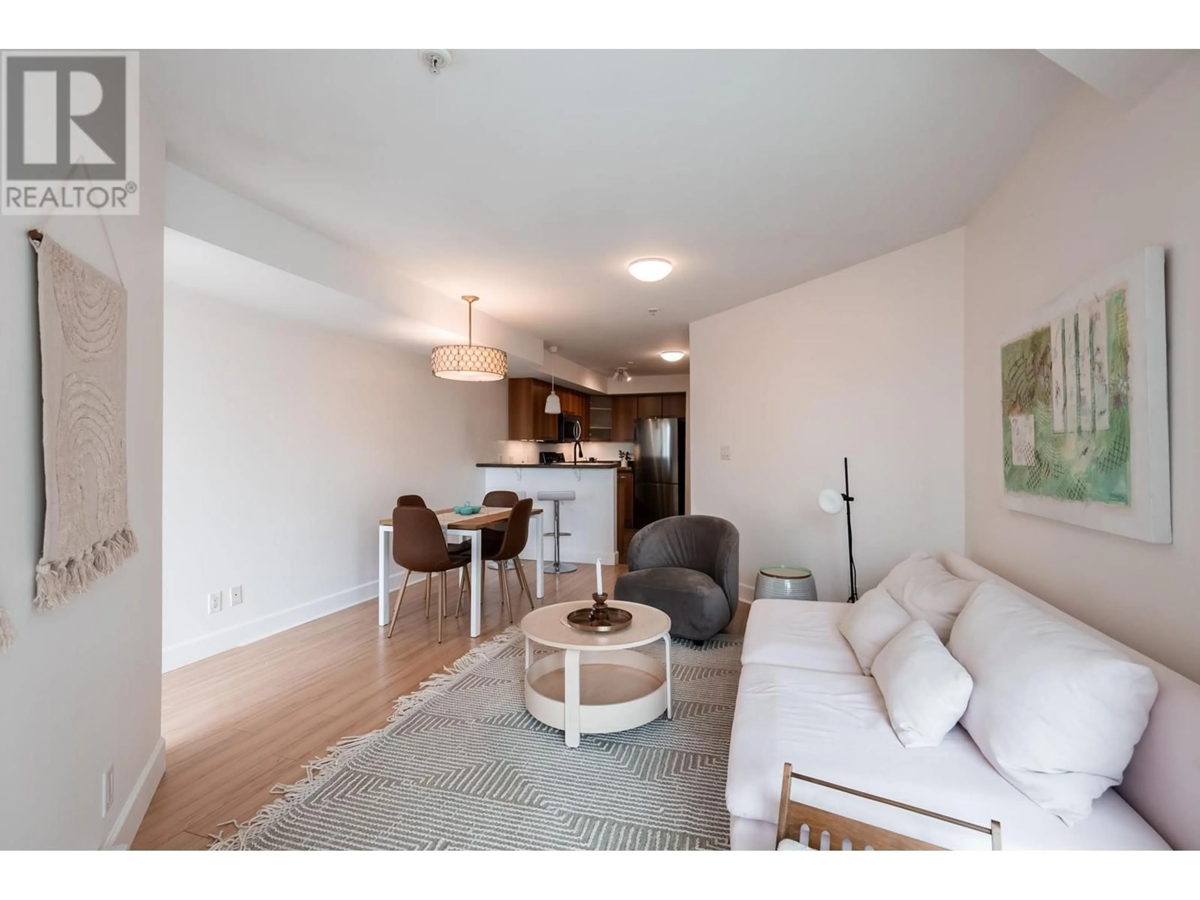 Living room with furniture, wood/laminate floor for 303 - 1718 VENABLES STREET, Vancouver British Columbia V5L2H4