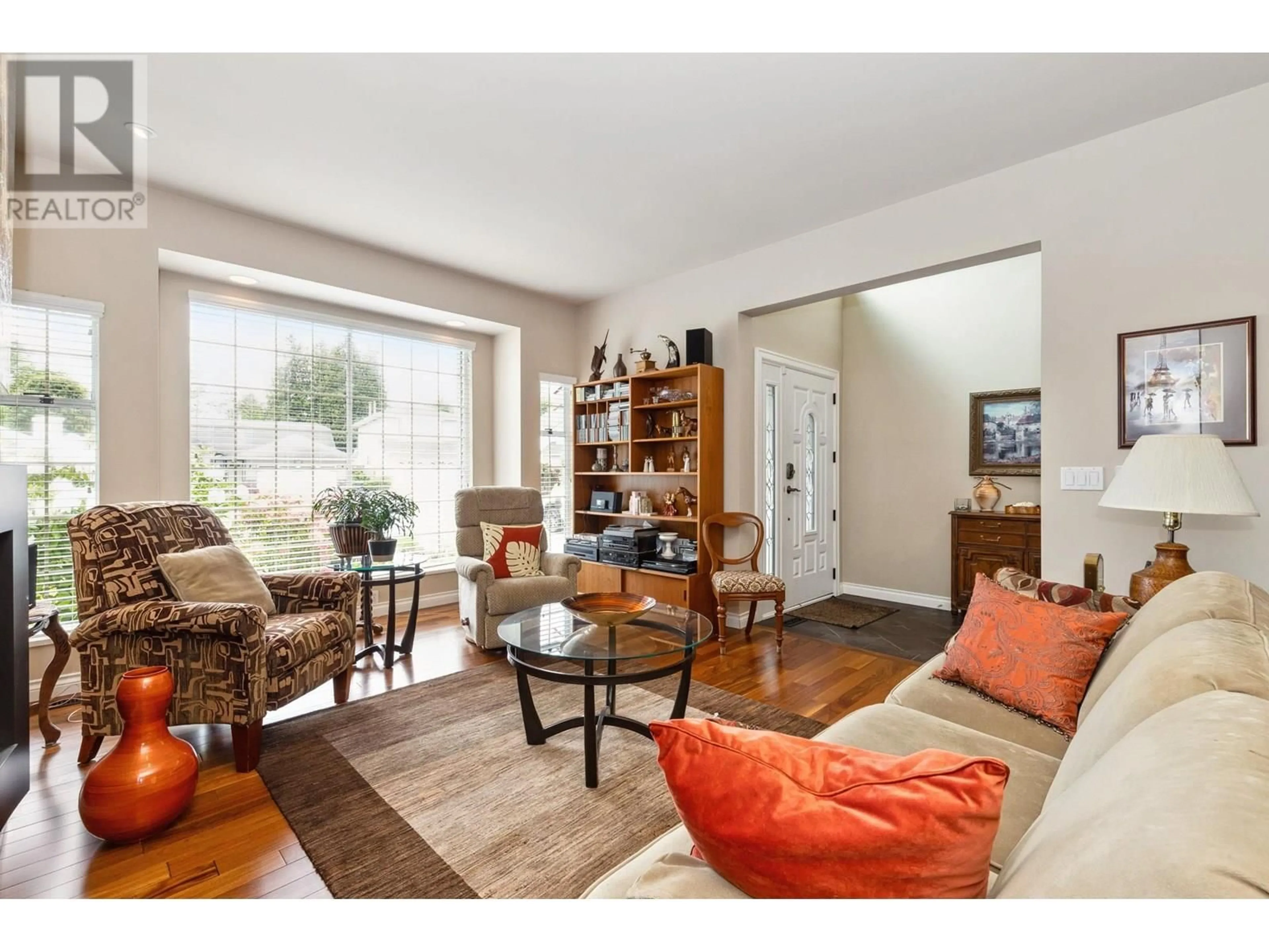 Living room with furniture, wood/laminate floor for 12019 CHESTNUT CRESCENT, Pitt Meadows British Columbia V3Y2L6