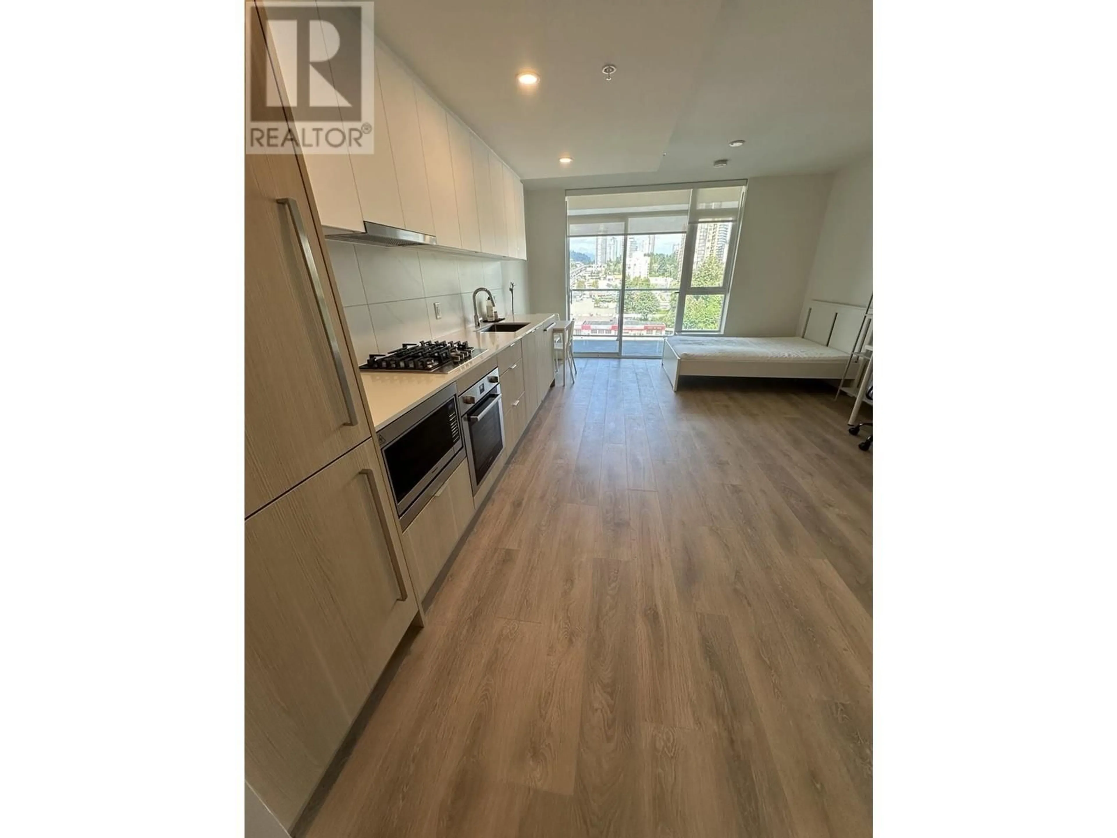 Open concept kitchen, wood/laminate floor for 910 - 318 ALDERSON AVENUE, Coquitlam British Columbia V3K0J1