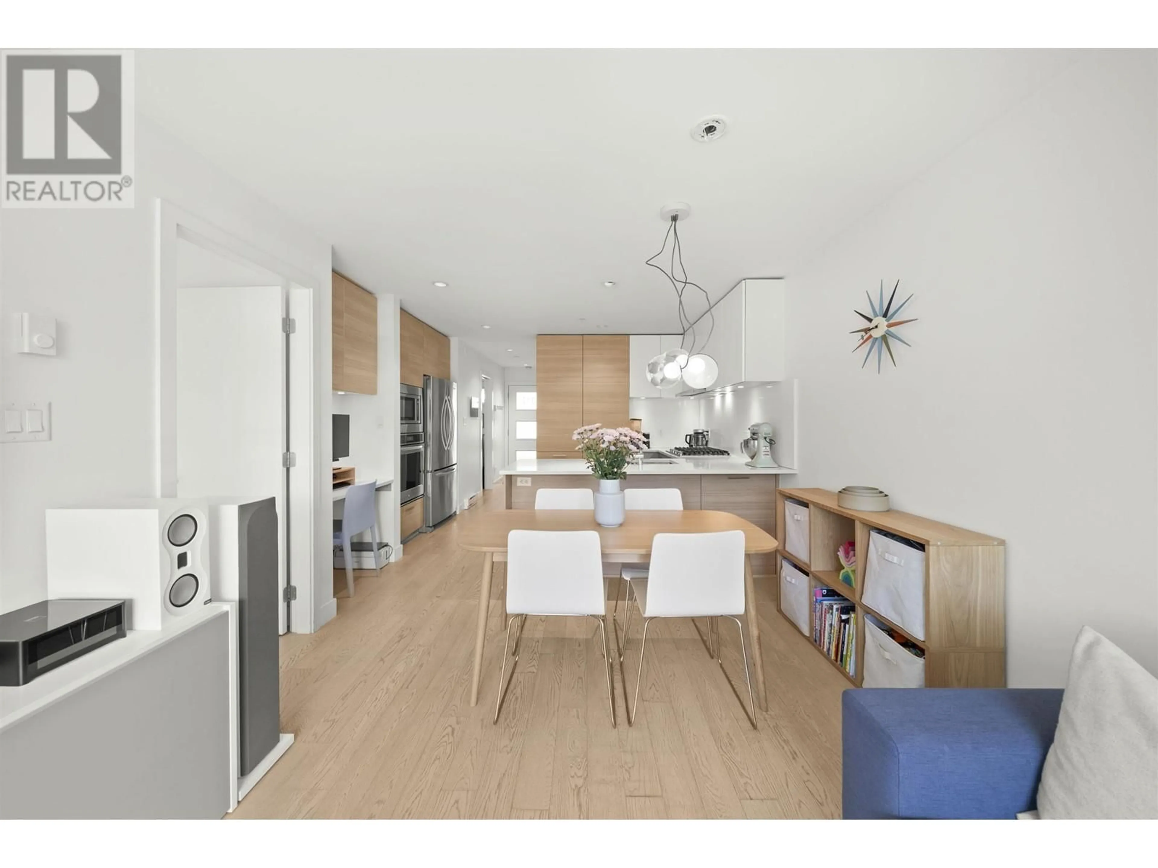 Open concept kitchen, wood/laminate floor for 317 - 3456 COMMERCIAL STREET, Vancouver British Columbia V5N4E9